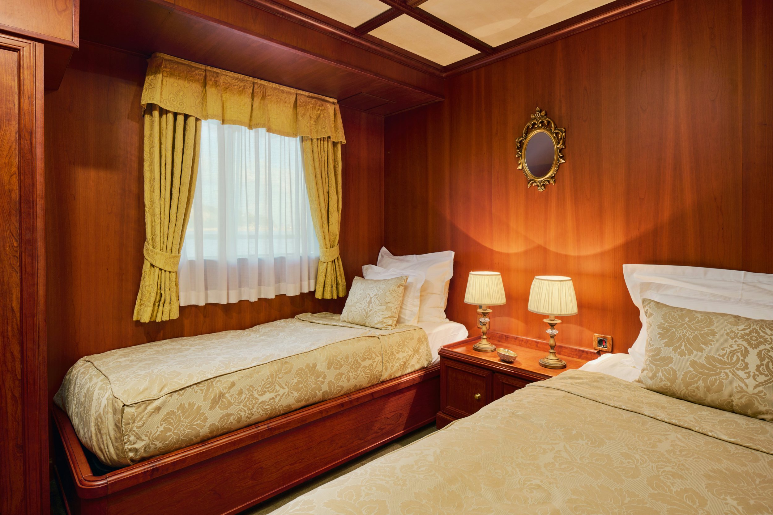 a couple of beds in a hotel room aboard SEAGULL II Yacht for Charter