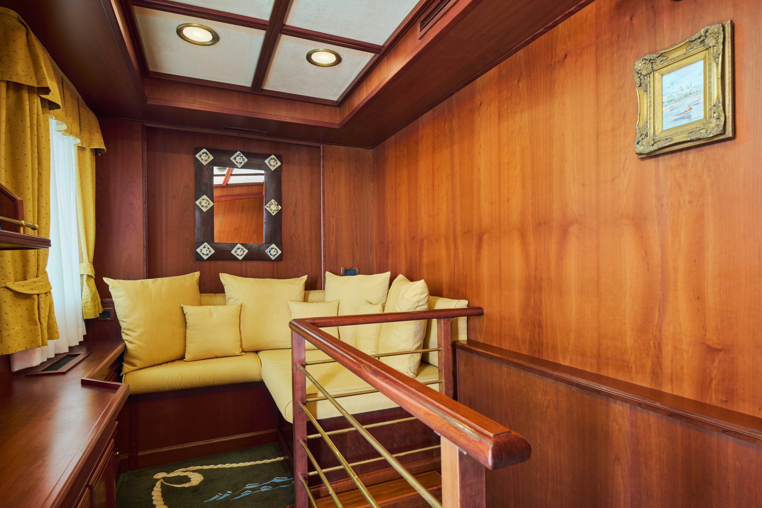 a room with a bed and a chair aboard SEAGULL II Yacht for Charter