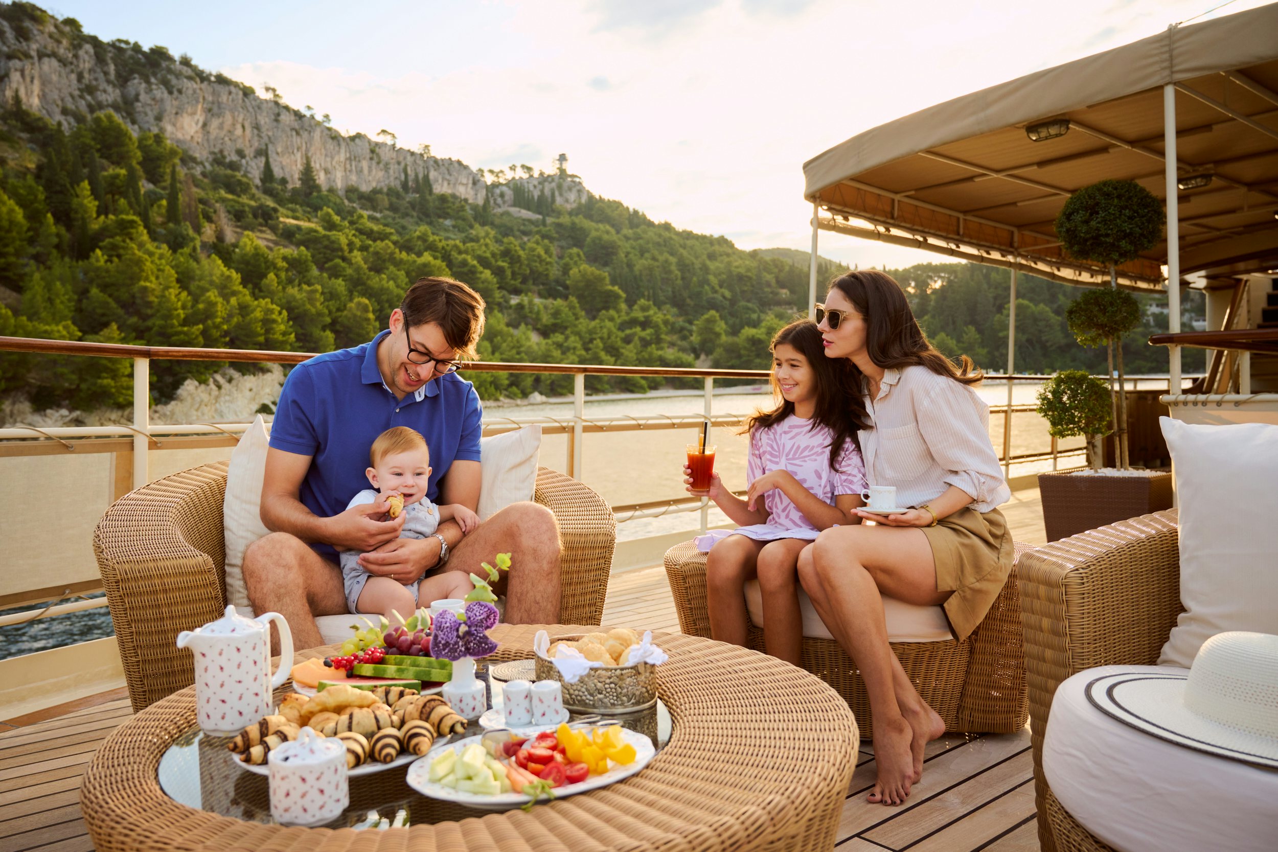 a family sitting on a couch aboard SEAGULL II Yacht for Charter