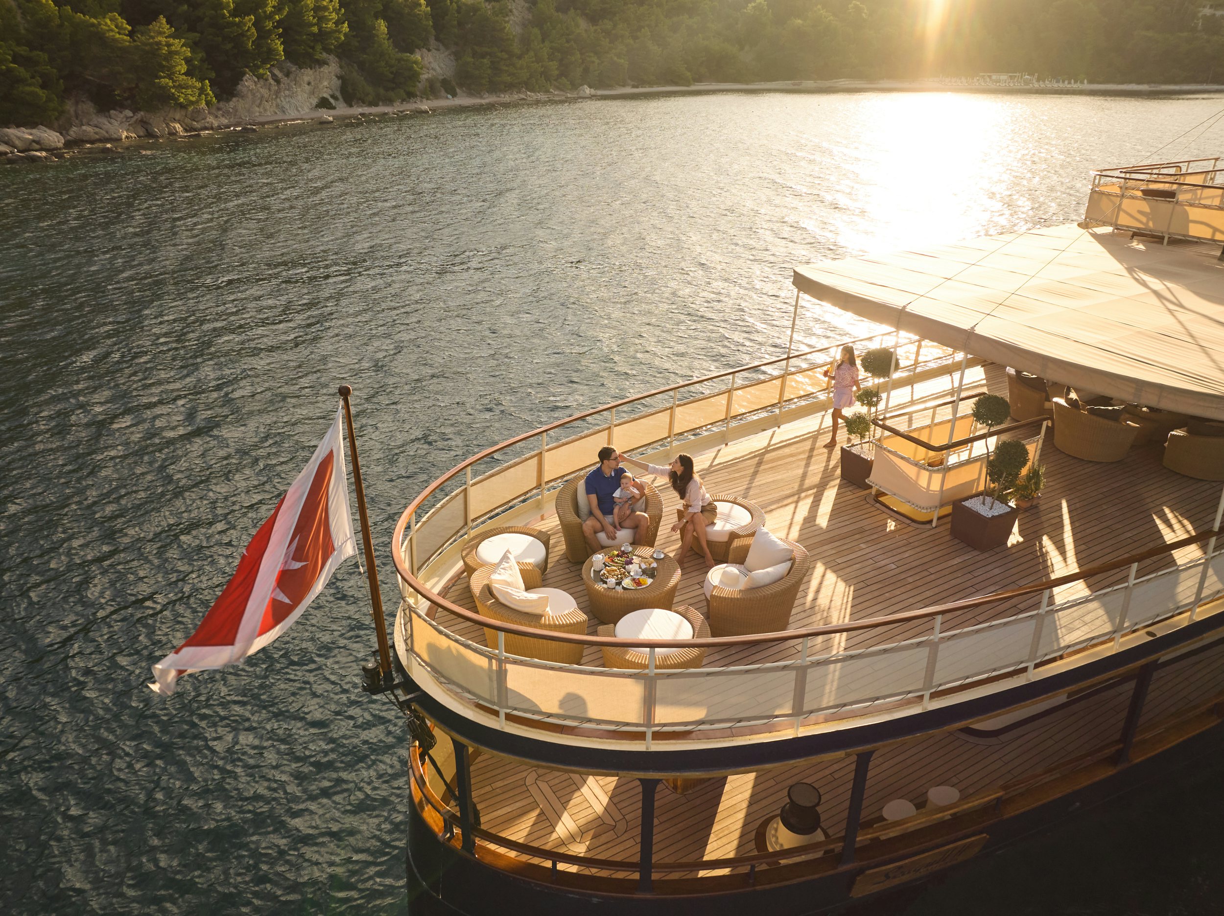 a boat with a flag on it aboard SEAGULL II Yacht for Charter
