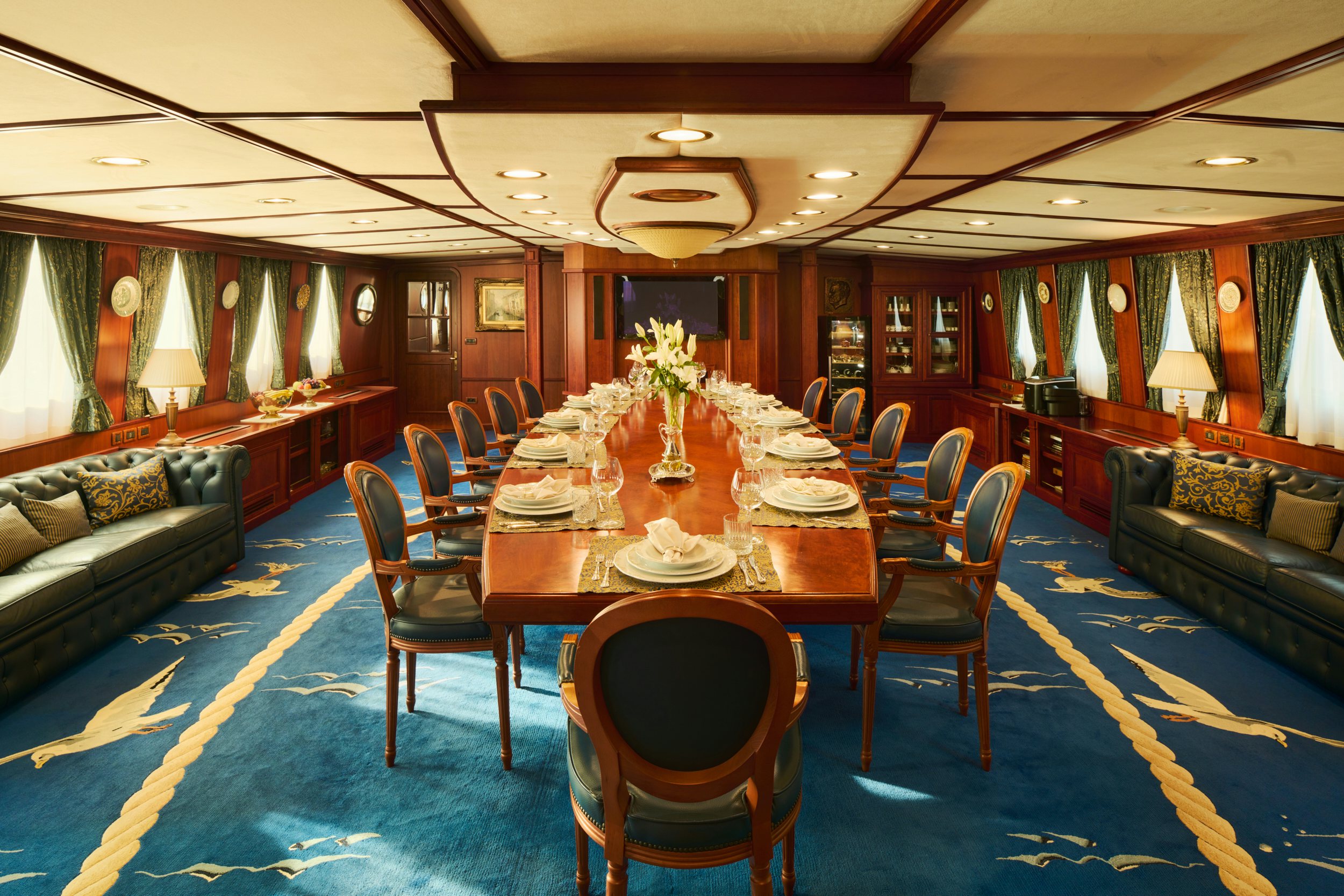 a dining room with a table and chairs aboard SEAGULL II Yacht for Charter