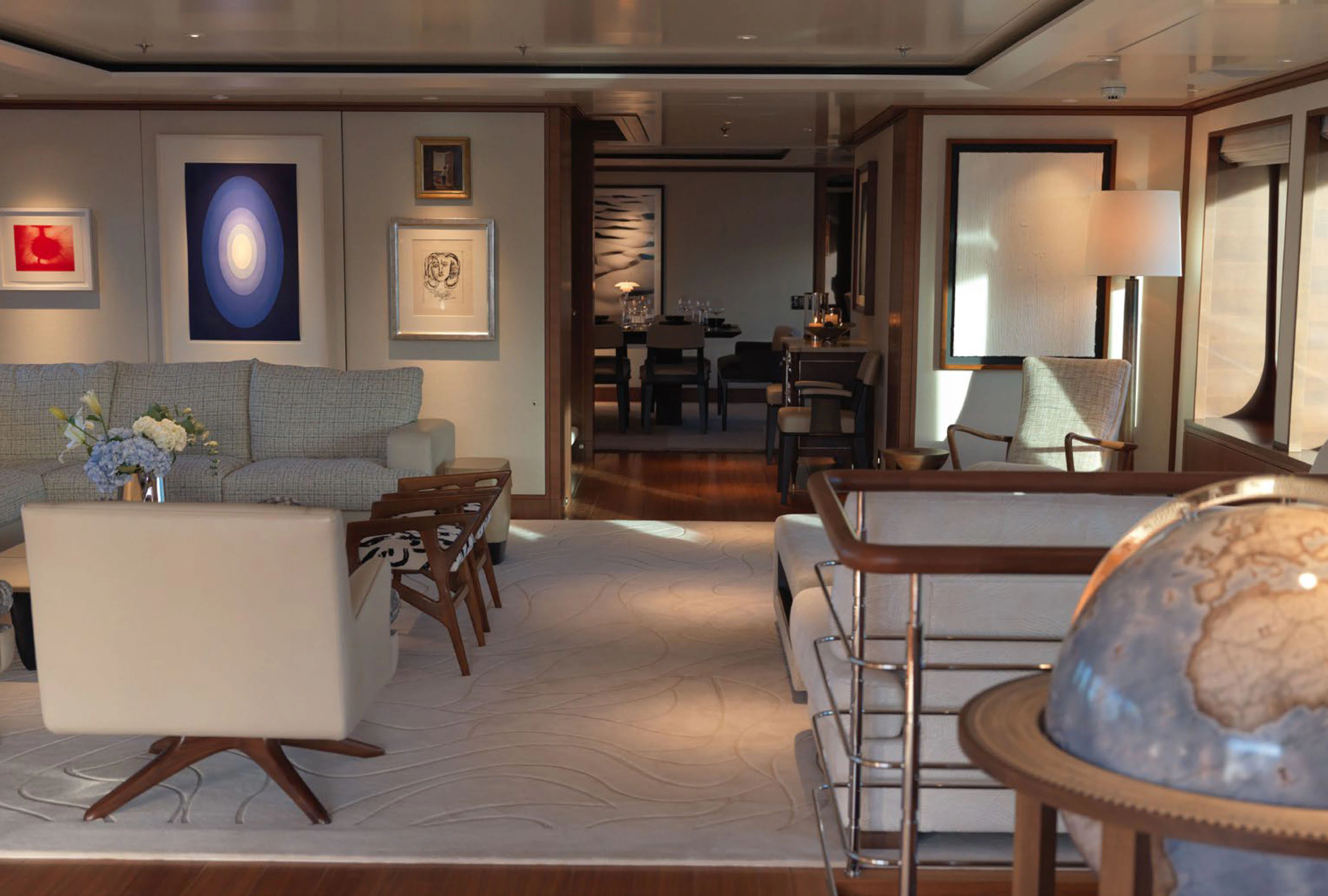 a living room with a couch and a table aboard SOLACE Yacht for Charter