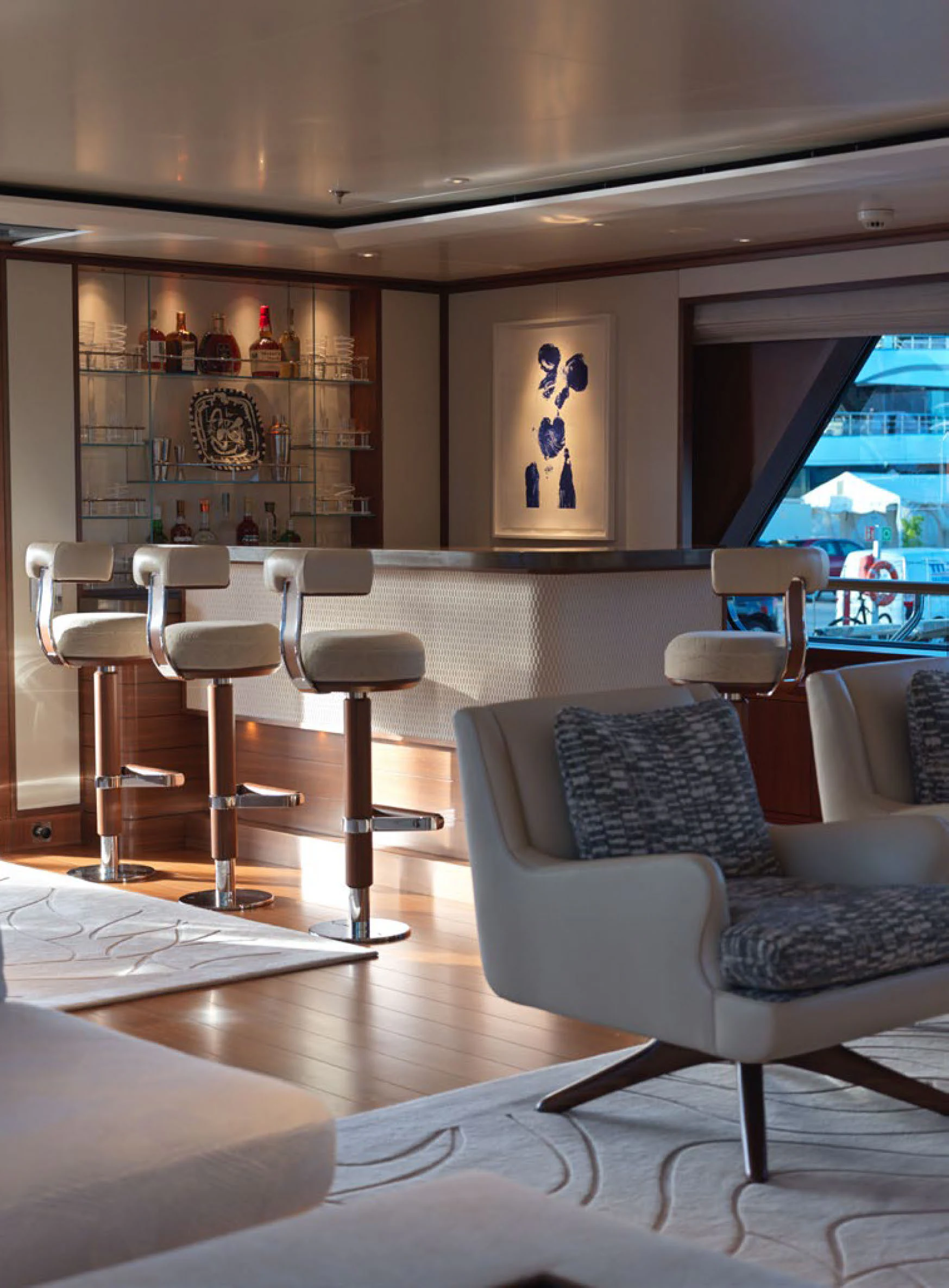 a room with a couch and chairs aboard SOLACE Yacht for Charter