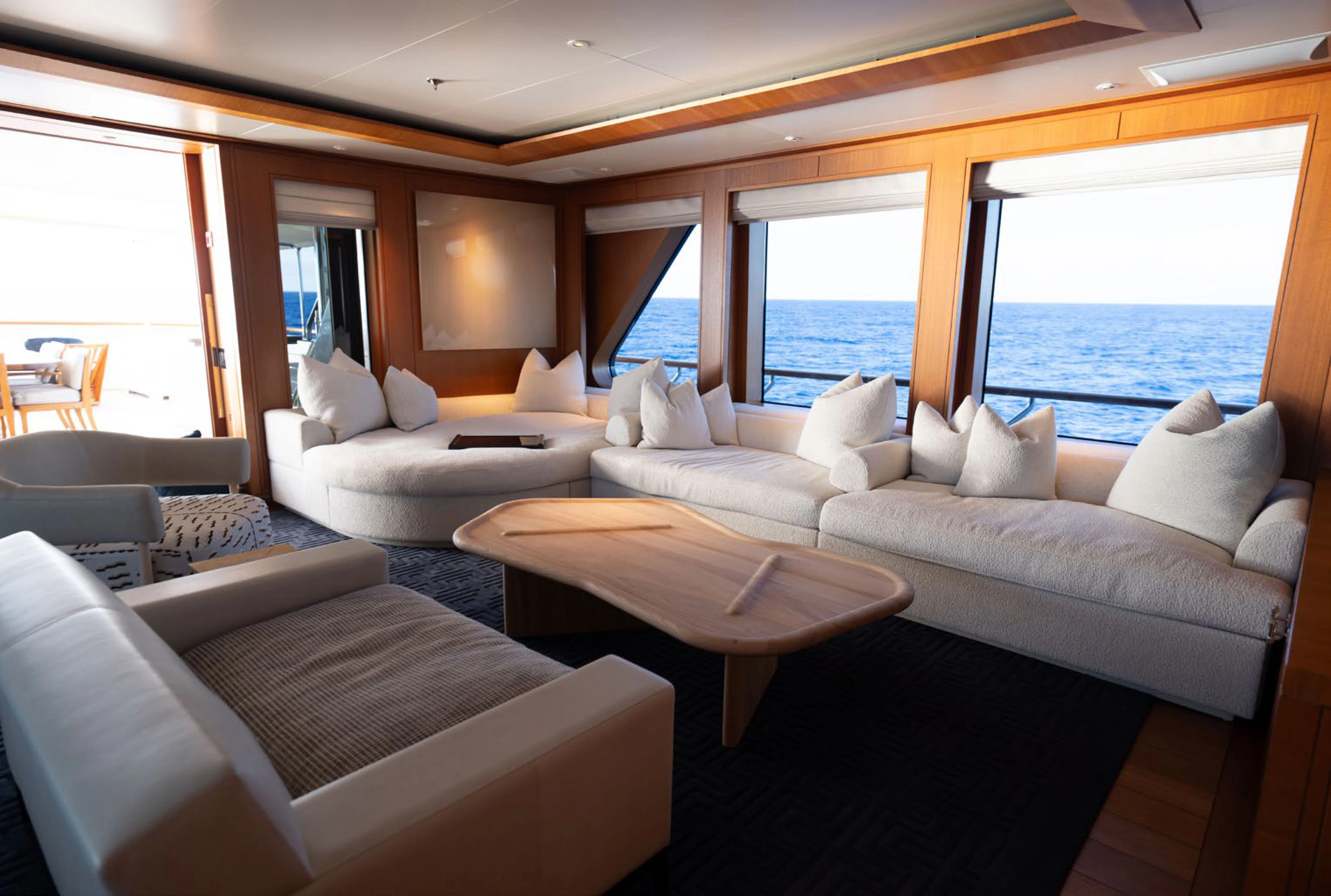 a living room with a large window aboard SOLACE Yacht for Charter