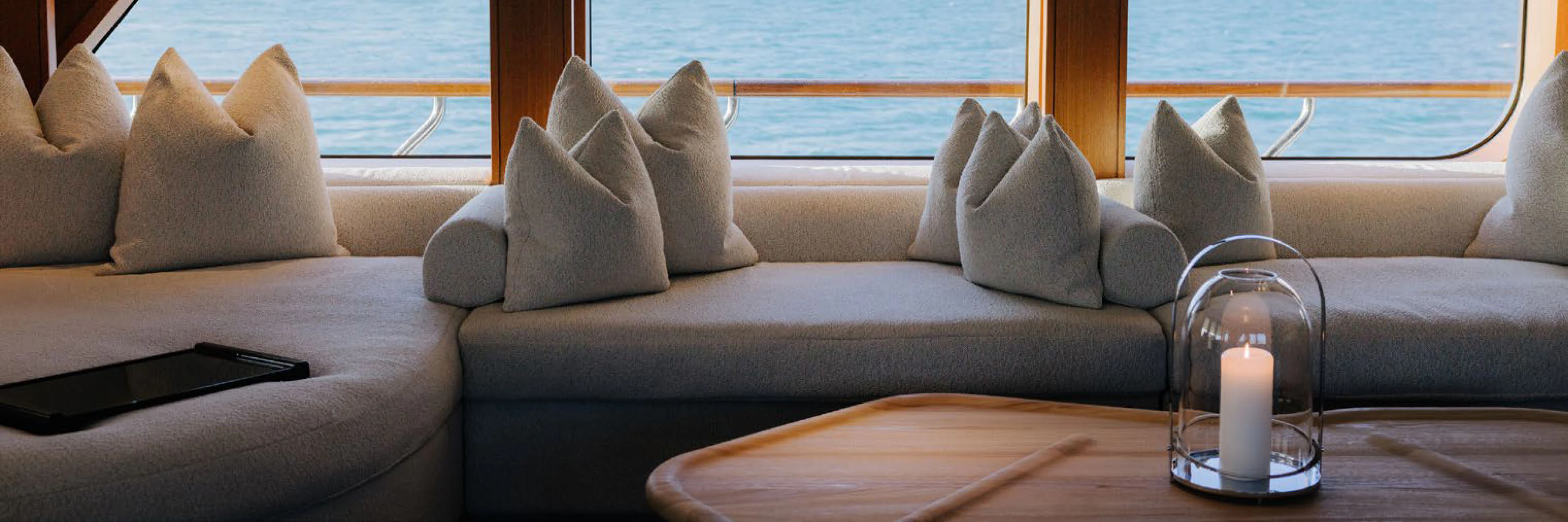 a glass of water on a table aboard SOLACE Yacht for Charter