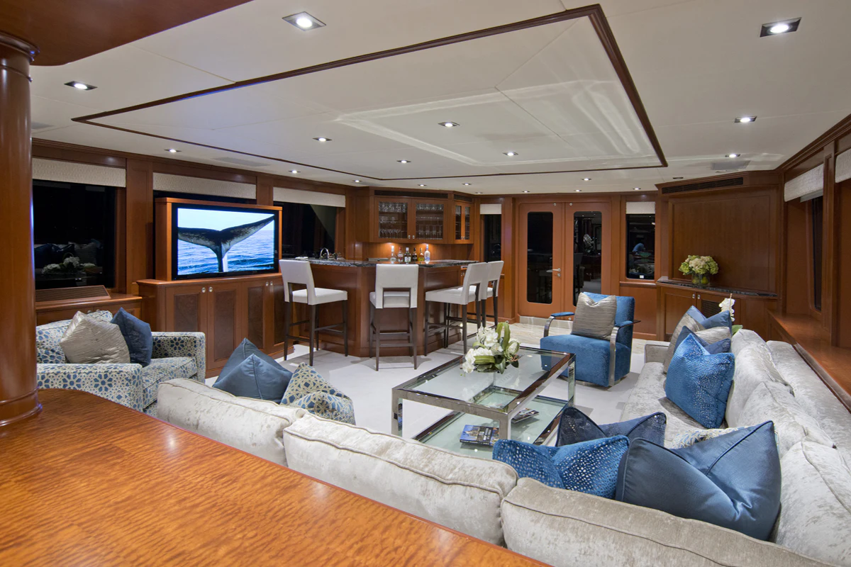a living room with a large screen aboard FORE ACES Yacht for Sale
