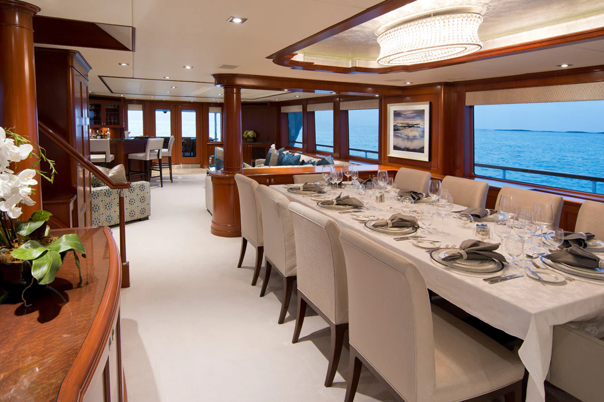 a dining room with a large table aboard FORE ACES Yacht for Sale