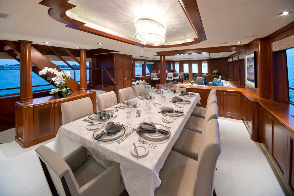 a large dining table in a large room aboard FORE ACES Yacht for Sale
