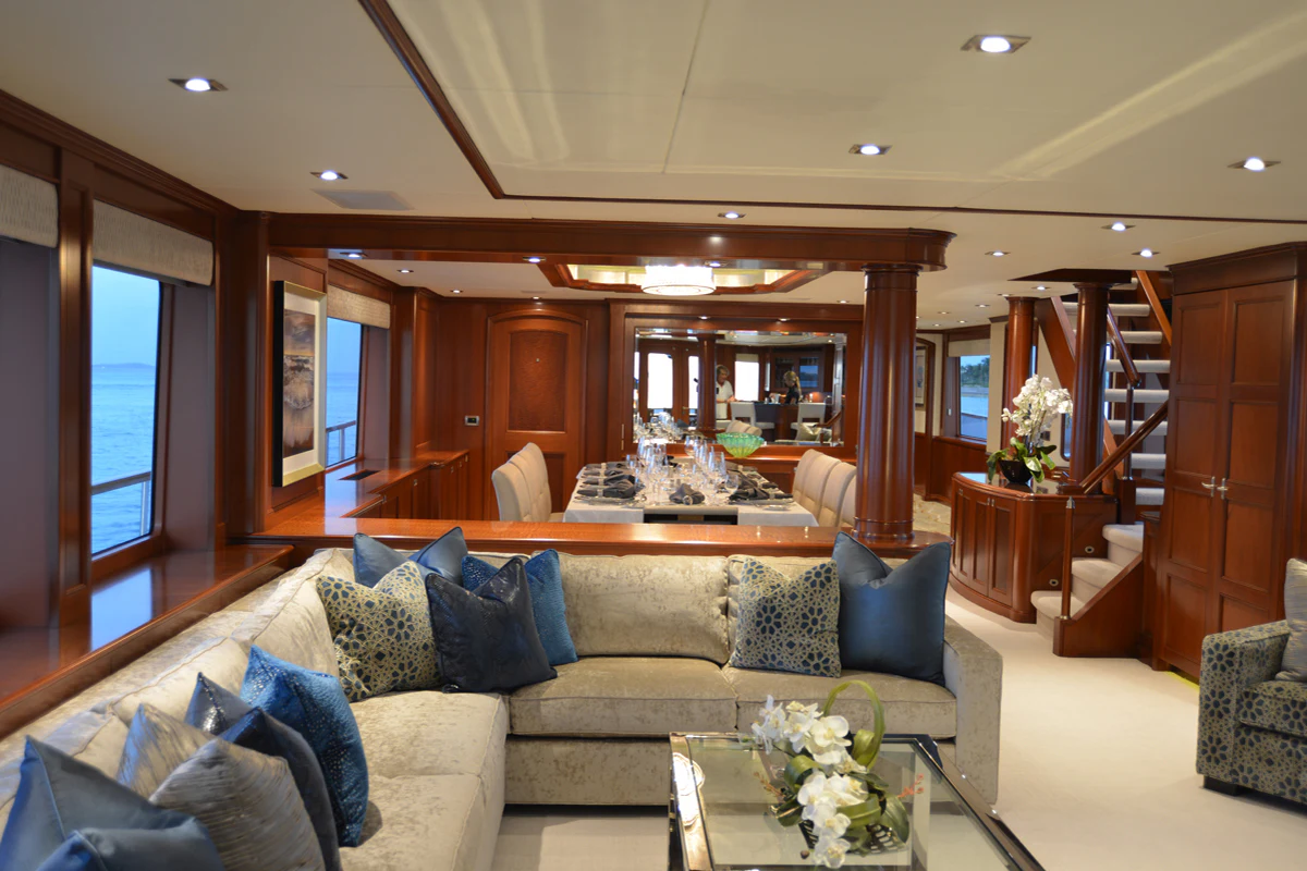 a living room with a couch and a table aboard FORE ACES Yacht for Sale