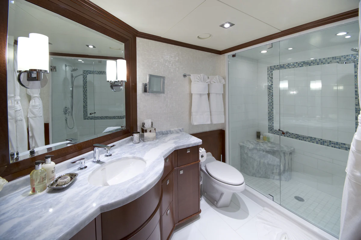 a bathroom with a large mirror aboard FORE ACES Yacht for Sale