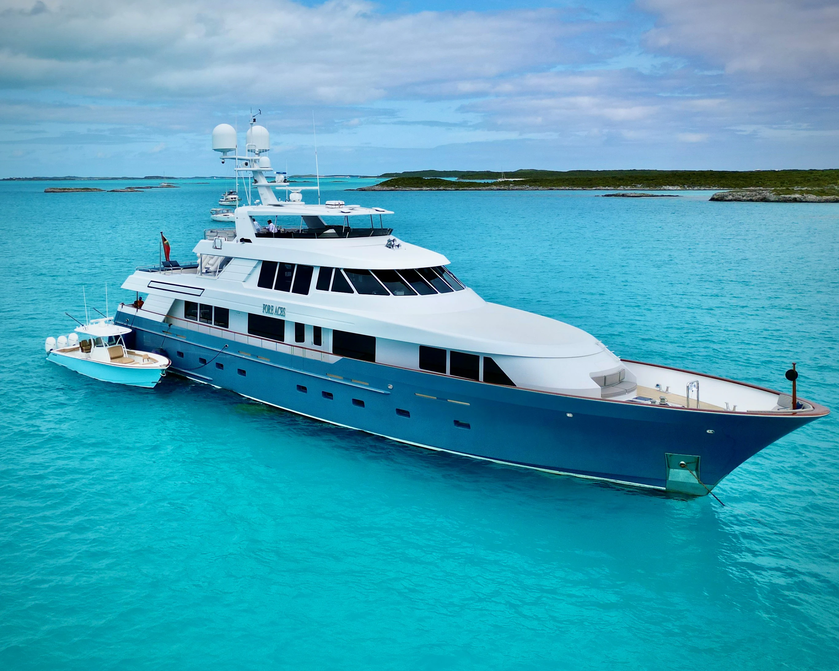 a large white boat in the water aboard FORE ACES Yacht for Sale