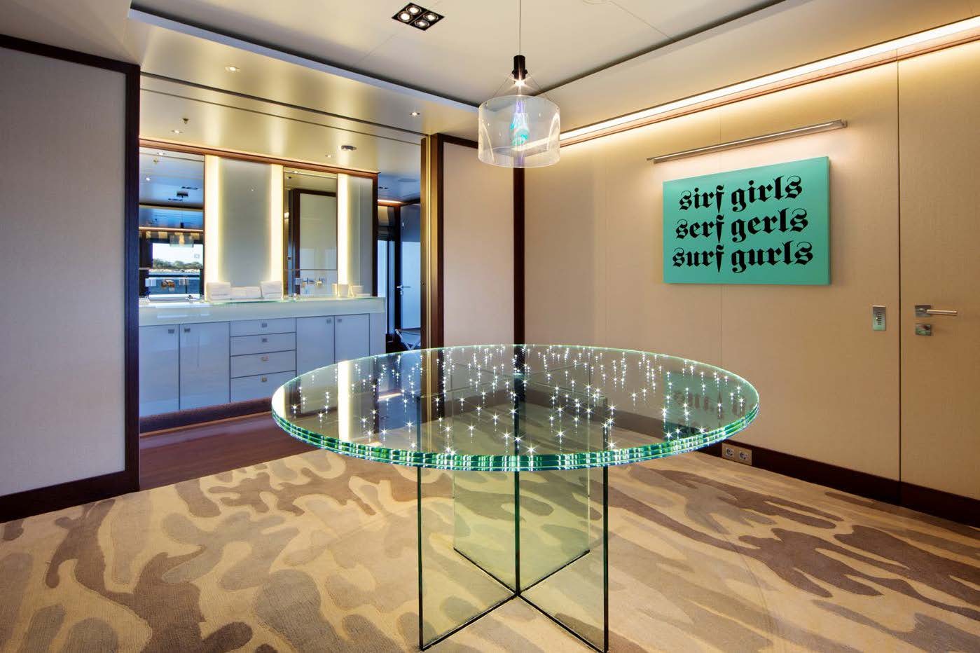 a glass table in a room aboard PLANET NINE Yacht for Sale