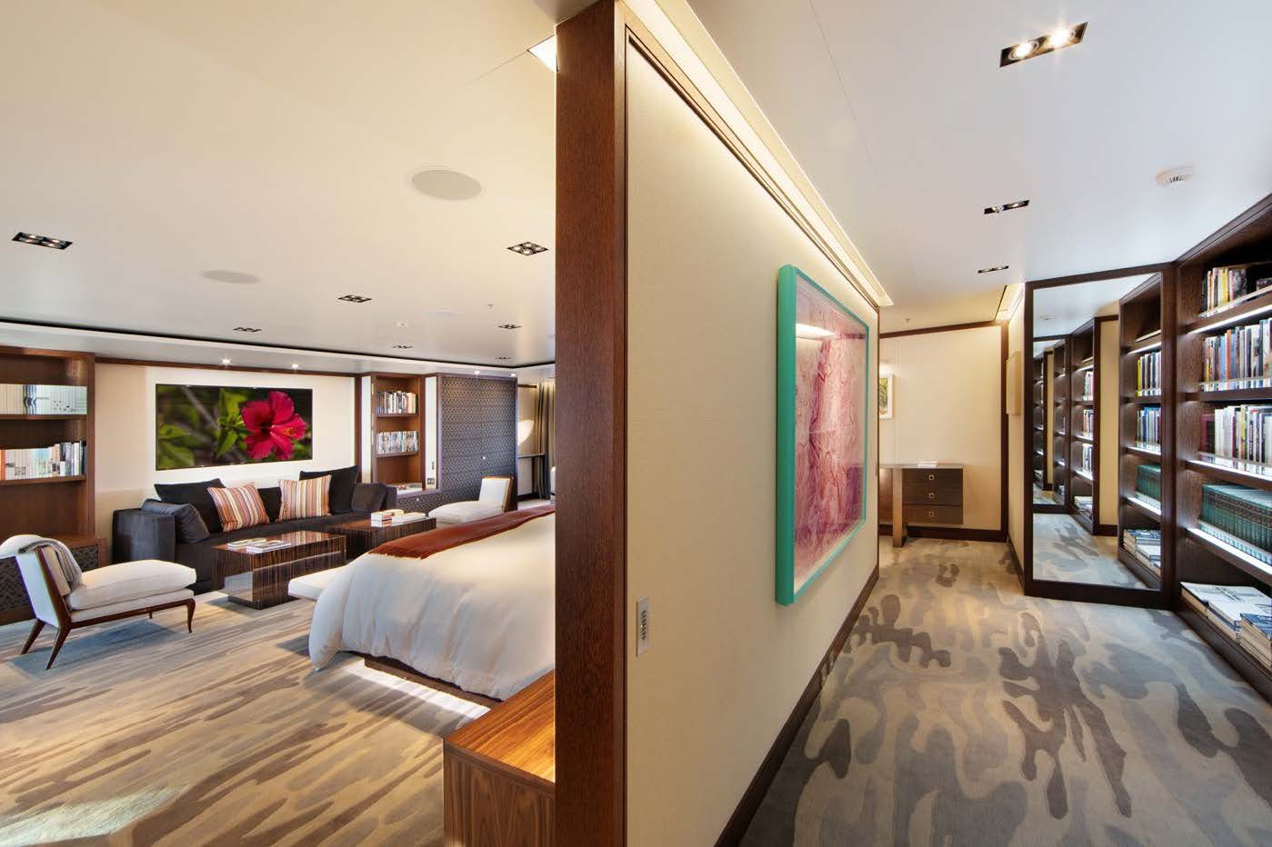 a room with a large mirror and a bed aboard PLANET NINE Yacht for Sale