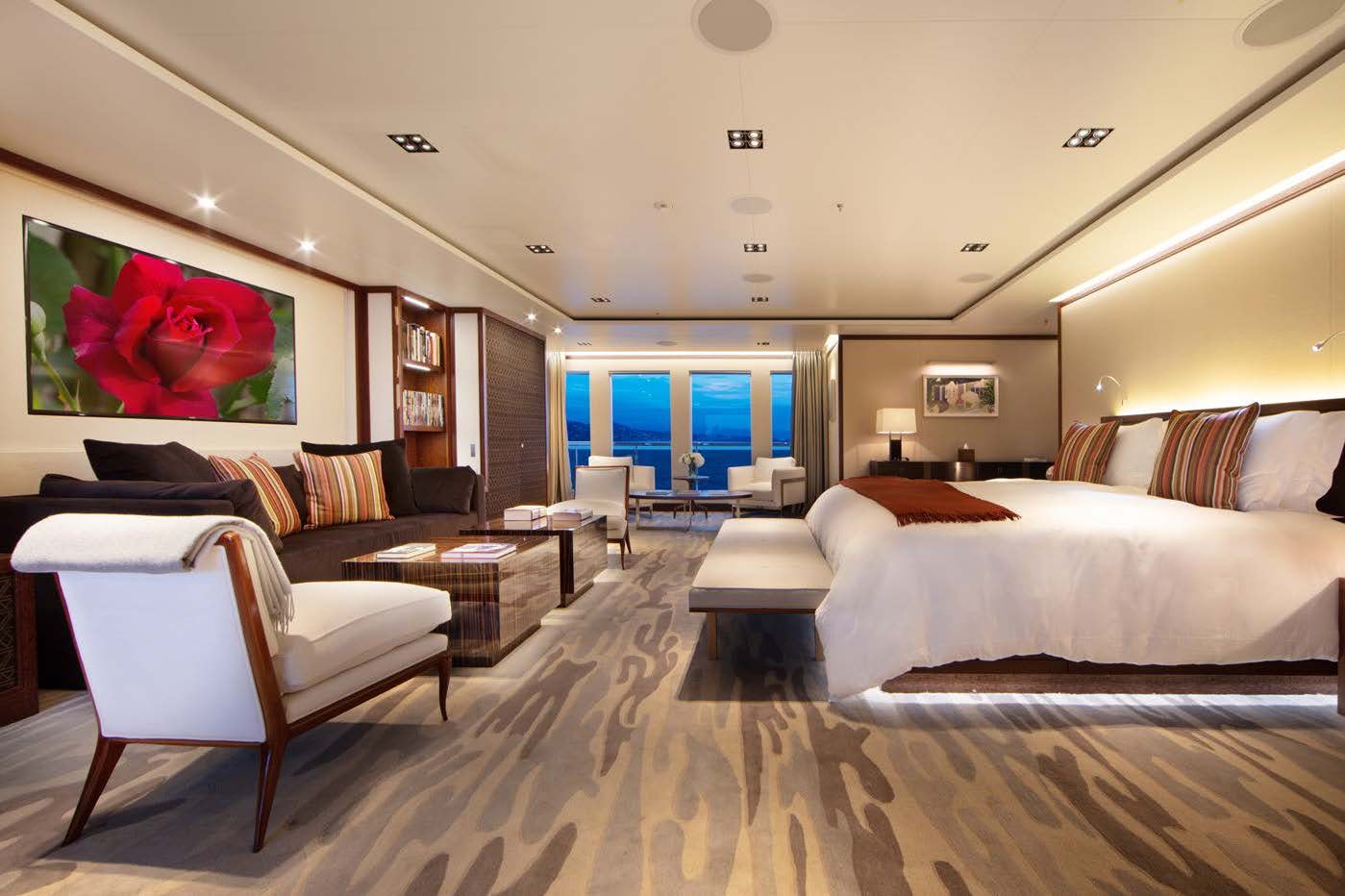 a room with a couch and a table and chairs aboard PLANET NINE Yacht for Sale
