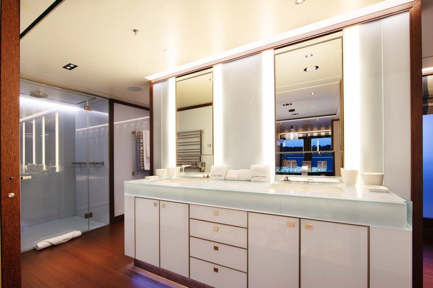a kitchen with white cabinets aboard PLANET NINE Yacht for Sale