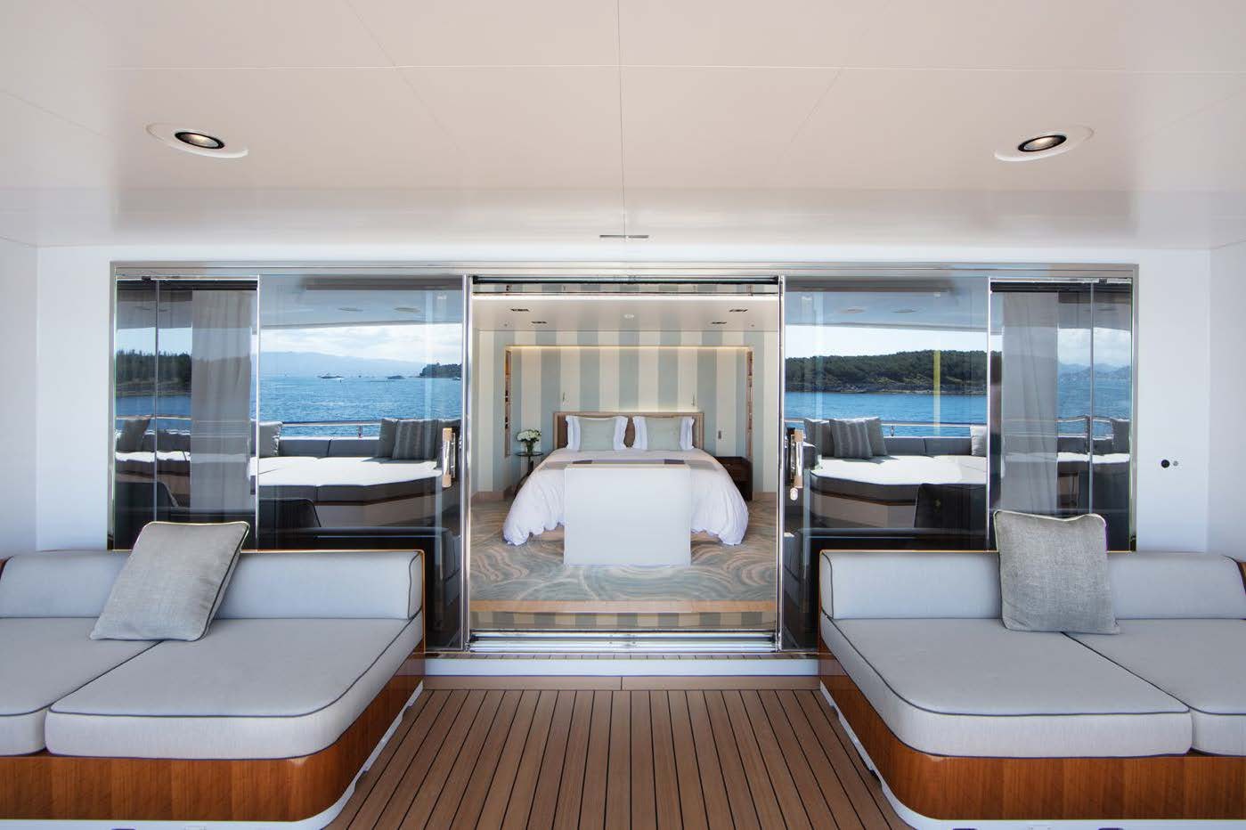 a room with a bed and a couch aboard PLANET NINE Yacht for Sale