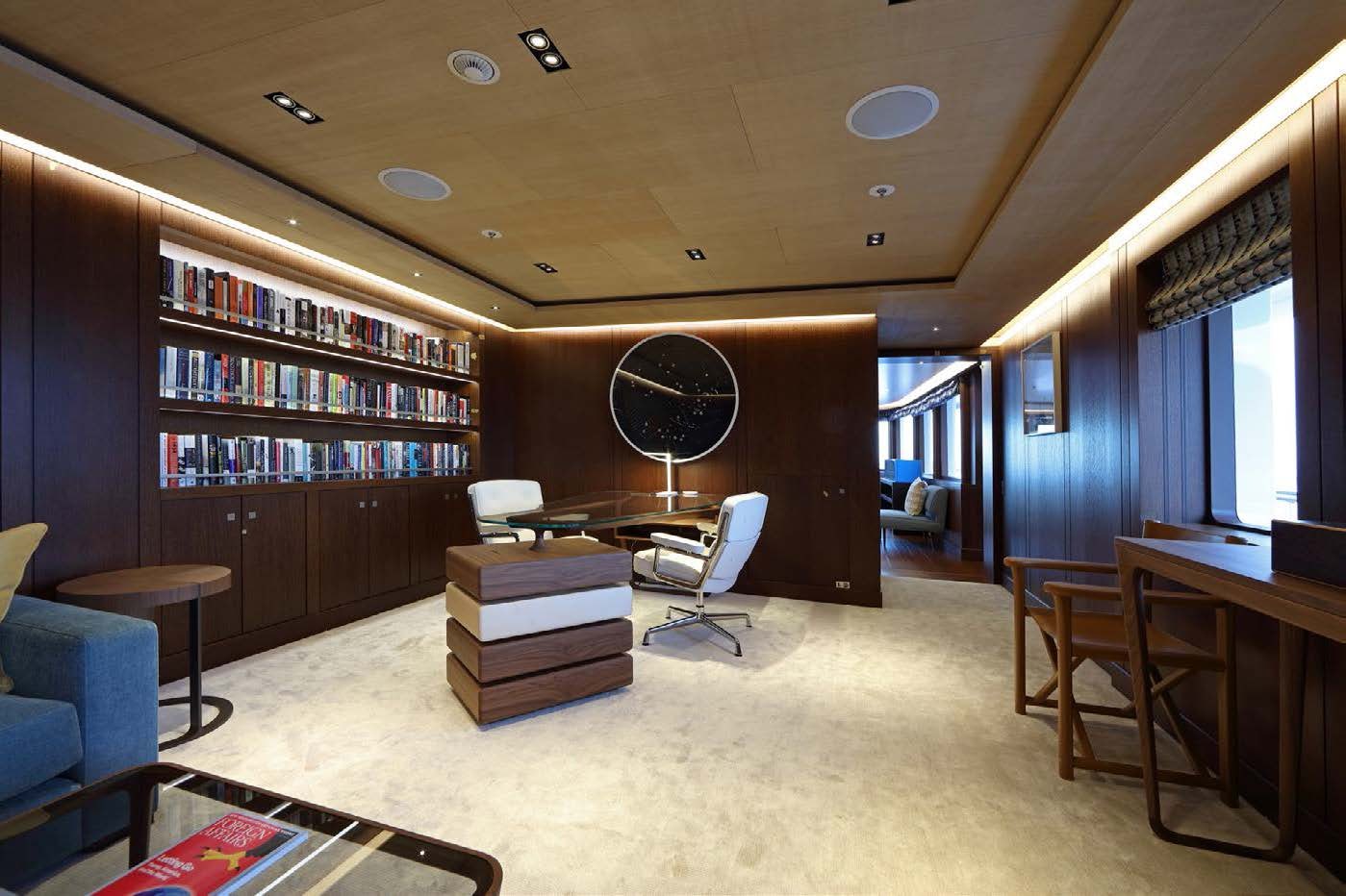 a room with a bookcase and a desk aboard PLANET NINE Yacht for Sale