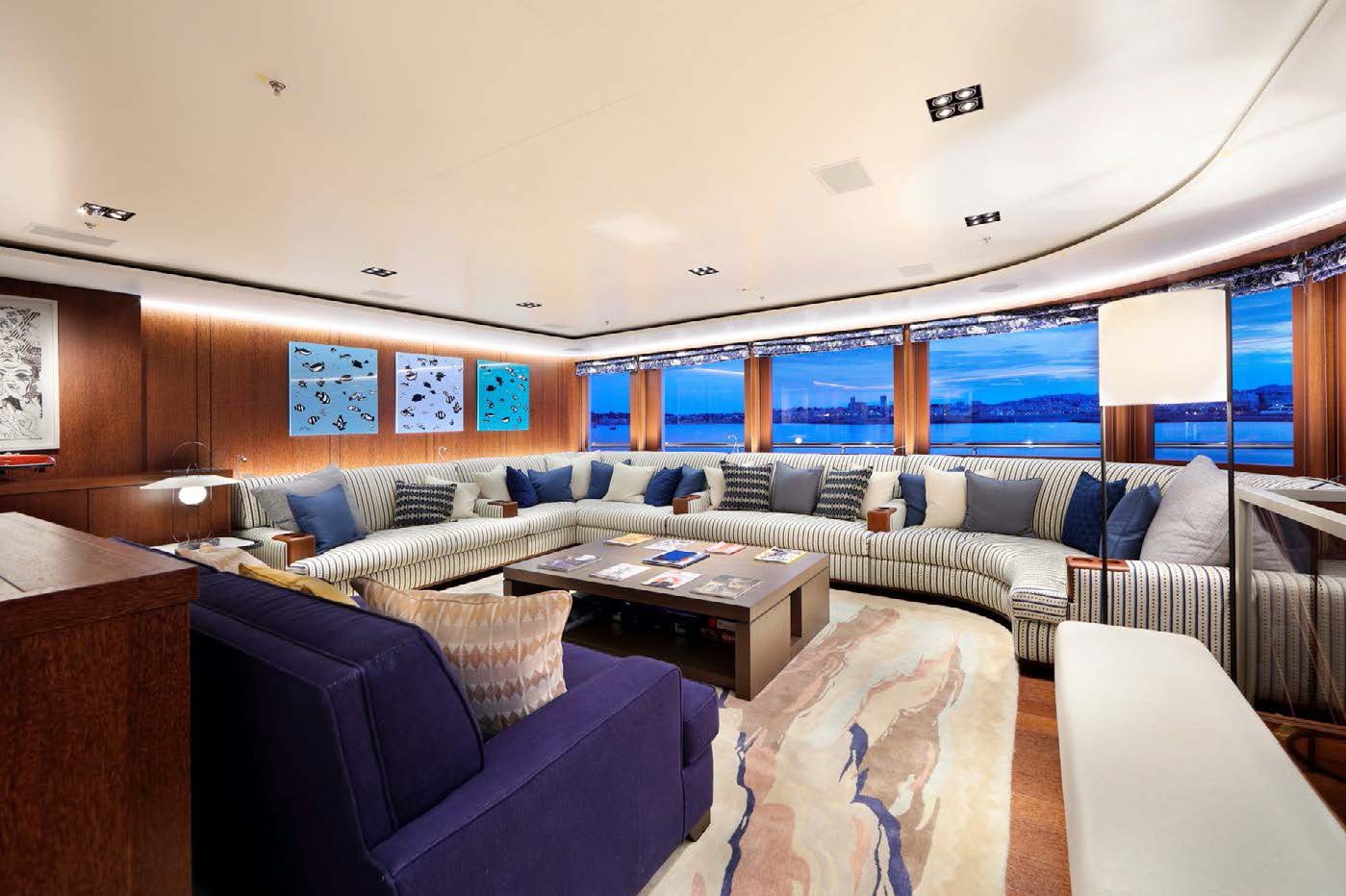 a room with couches and a table aboard PLANET NINE Yacht for Sale