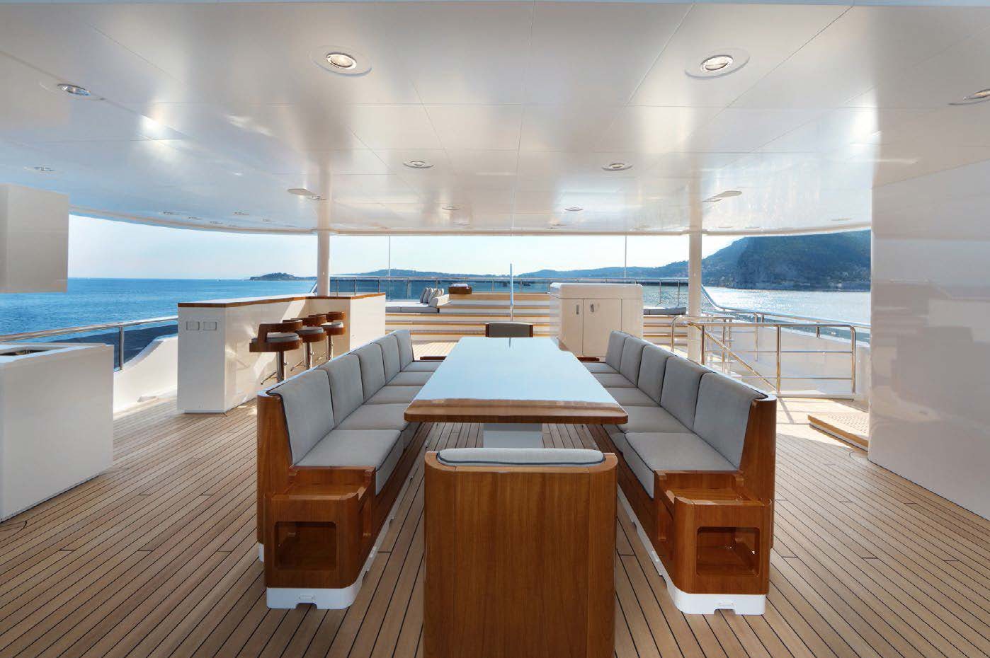 a room with a table and chairs aboard PLANET NINE Yacht for Sale