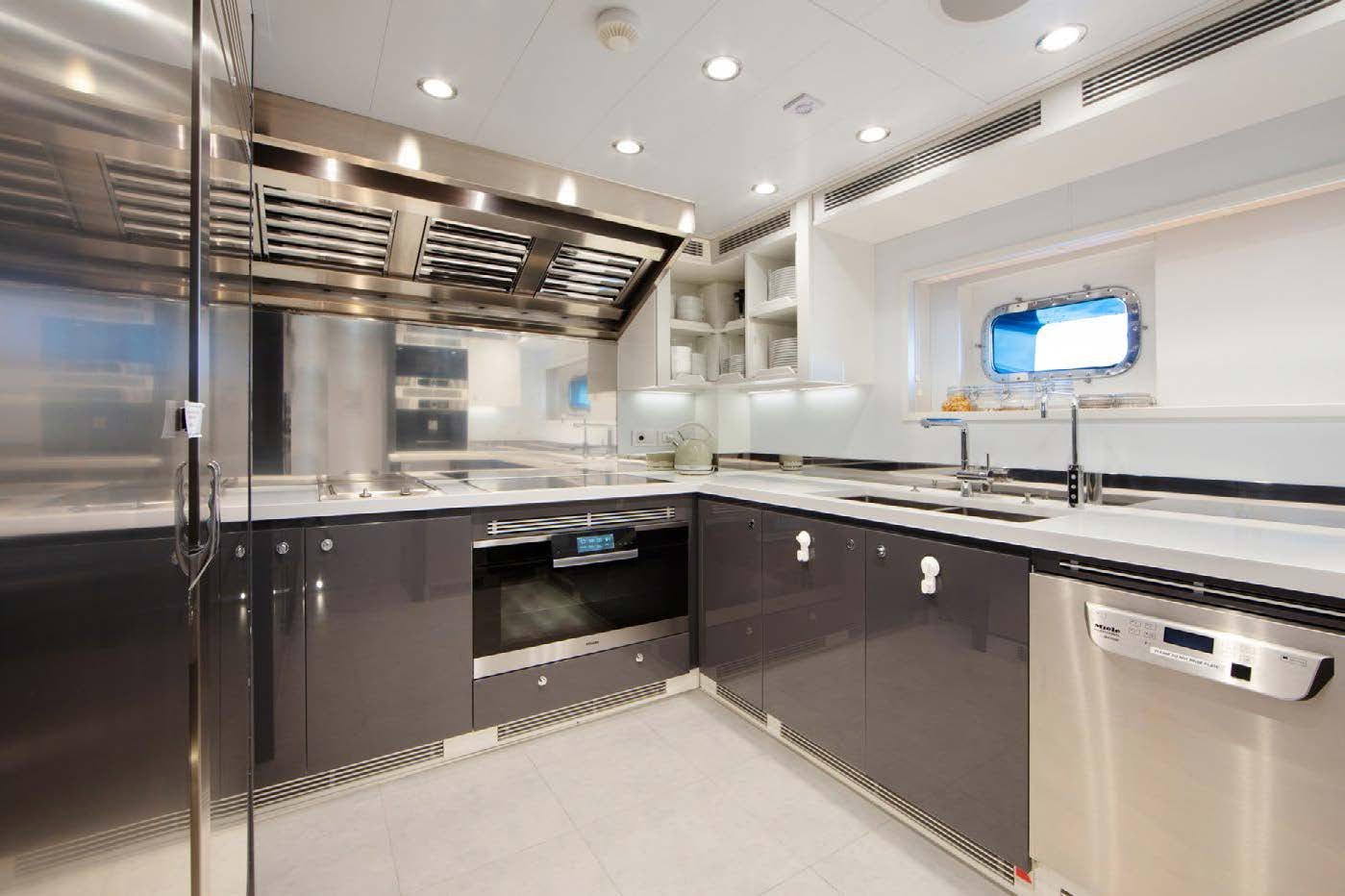 a kitchen with stainless steel appliances aboard PLANET NINE Yacht for Sale