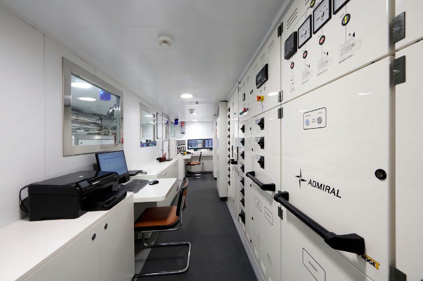 a room with white walls and a computer on it aboard PLANET NINE Yacht for Sale