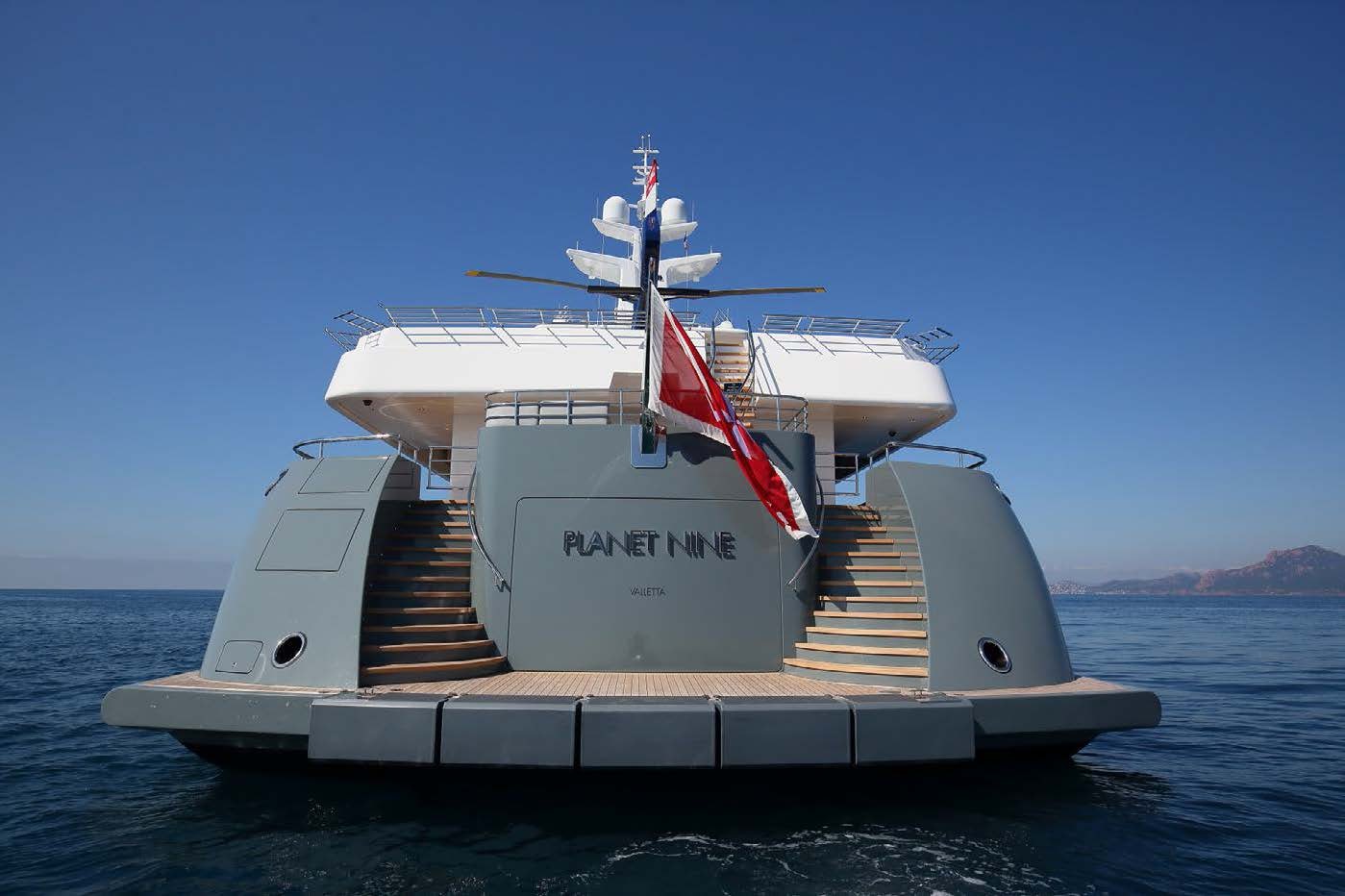 a large white ship in the water aboard PLANET NINE Yacht for Sale