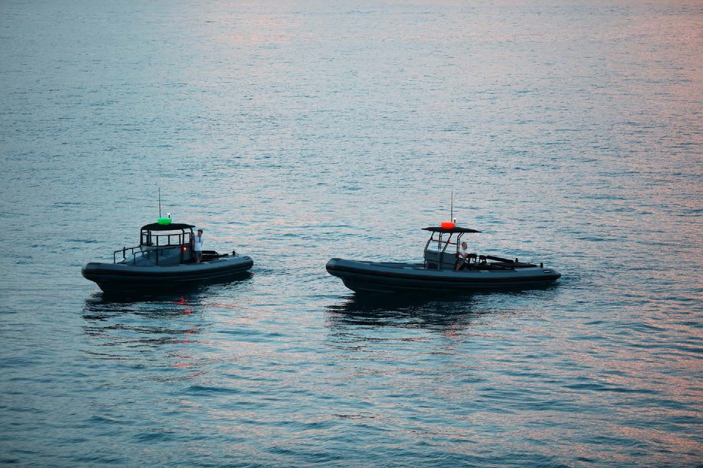 a couple of boats in the water aboard PLANET NINE Yacht for Sale