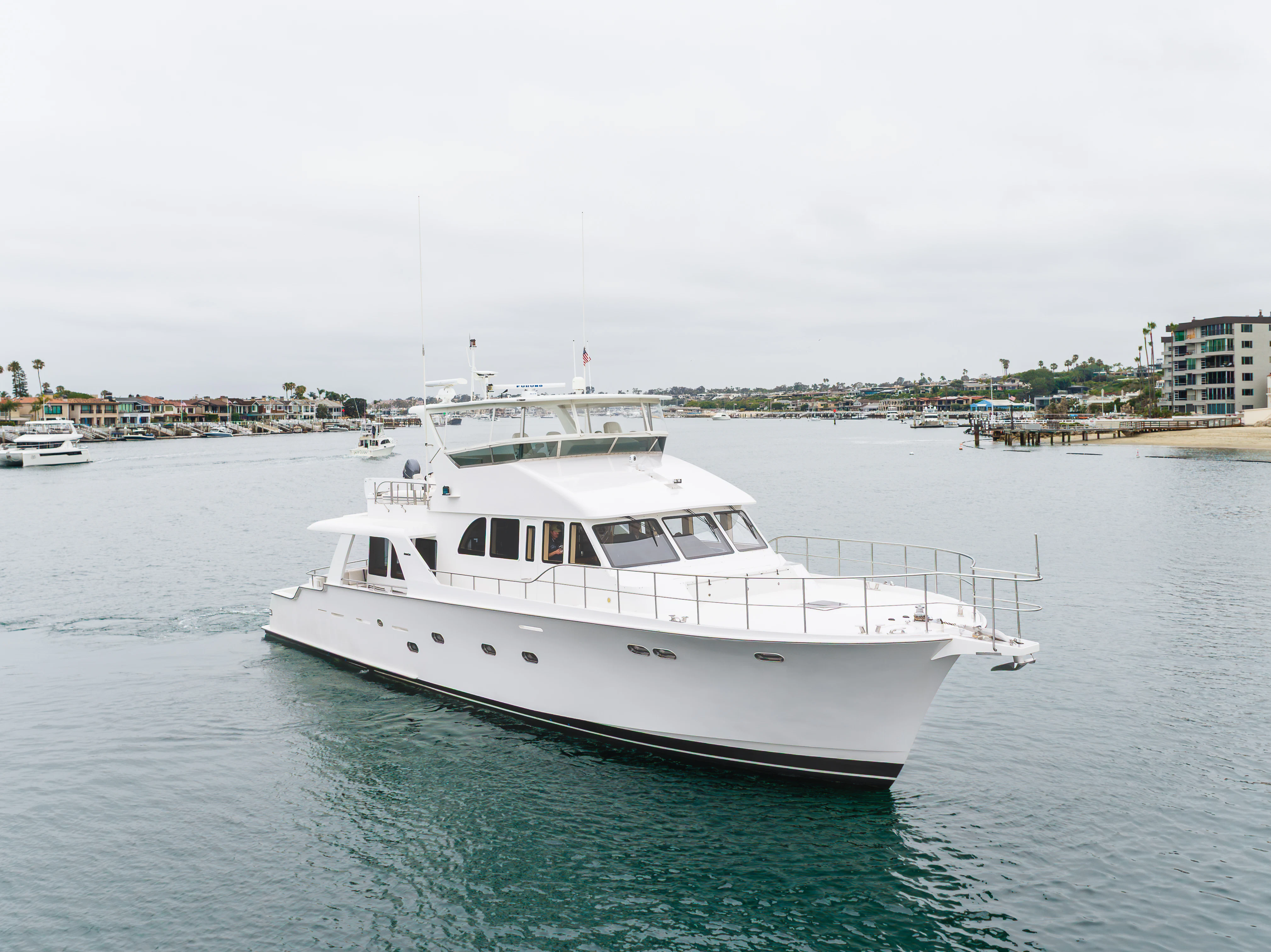 a white boat in the water aboard EASY Yacht for Sale