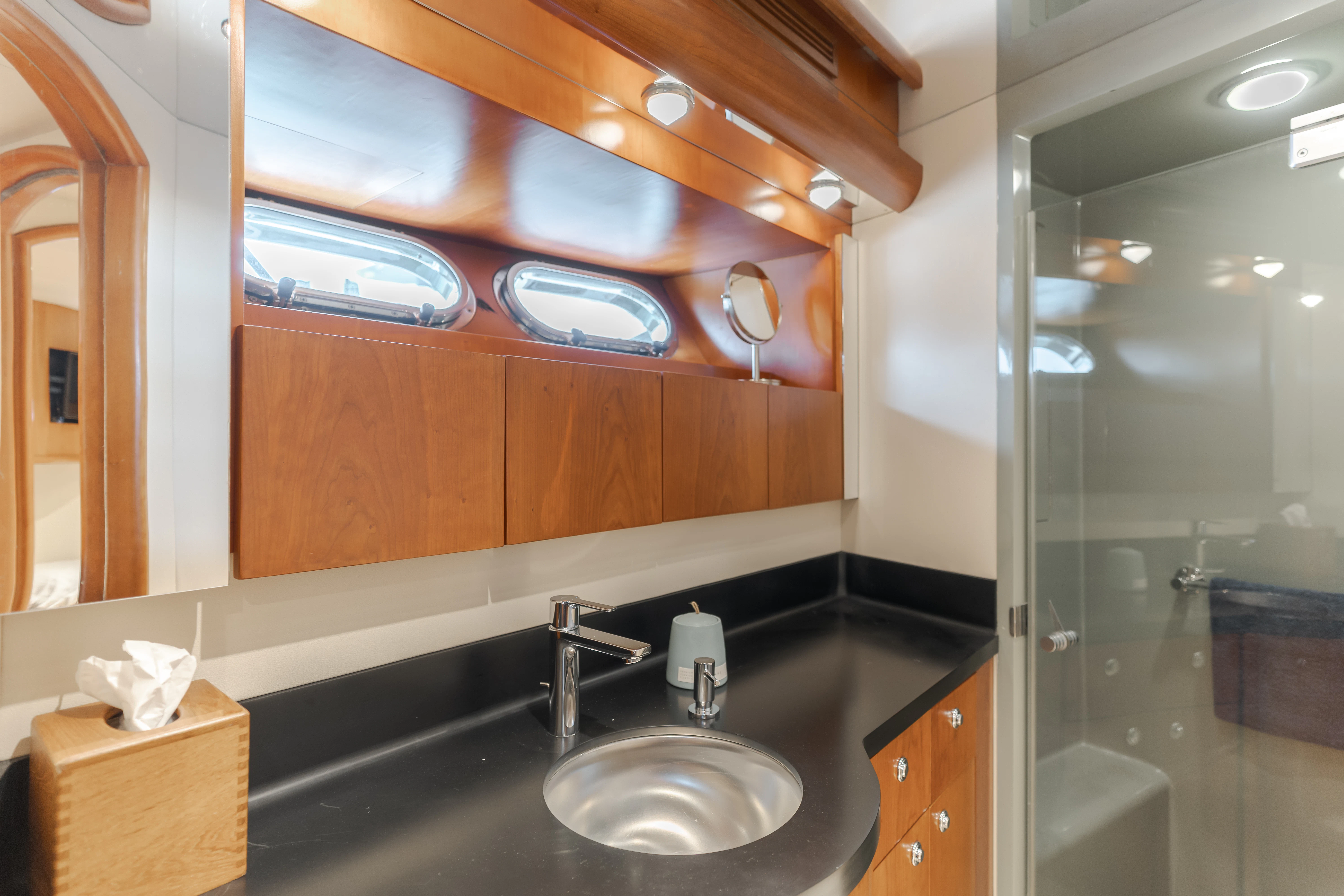a bathroom with a sink and a mirror aboard EASY Yacht for Sale