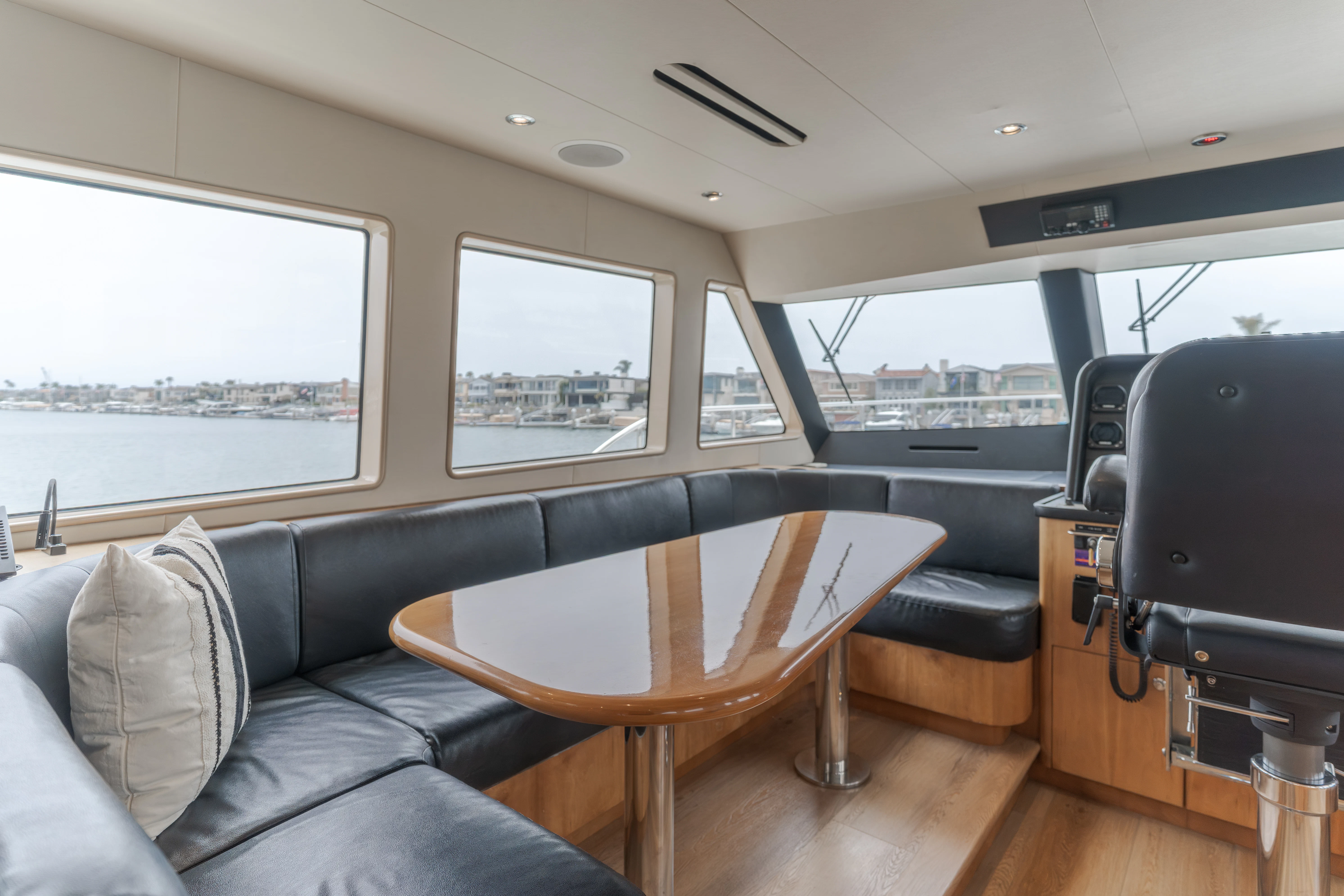 a table and chairs in a room aboard EASY Yacht for Sale