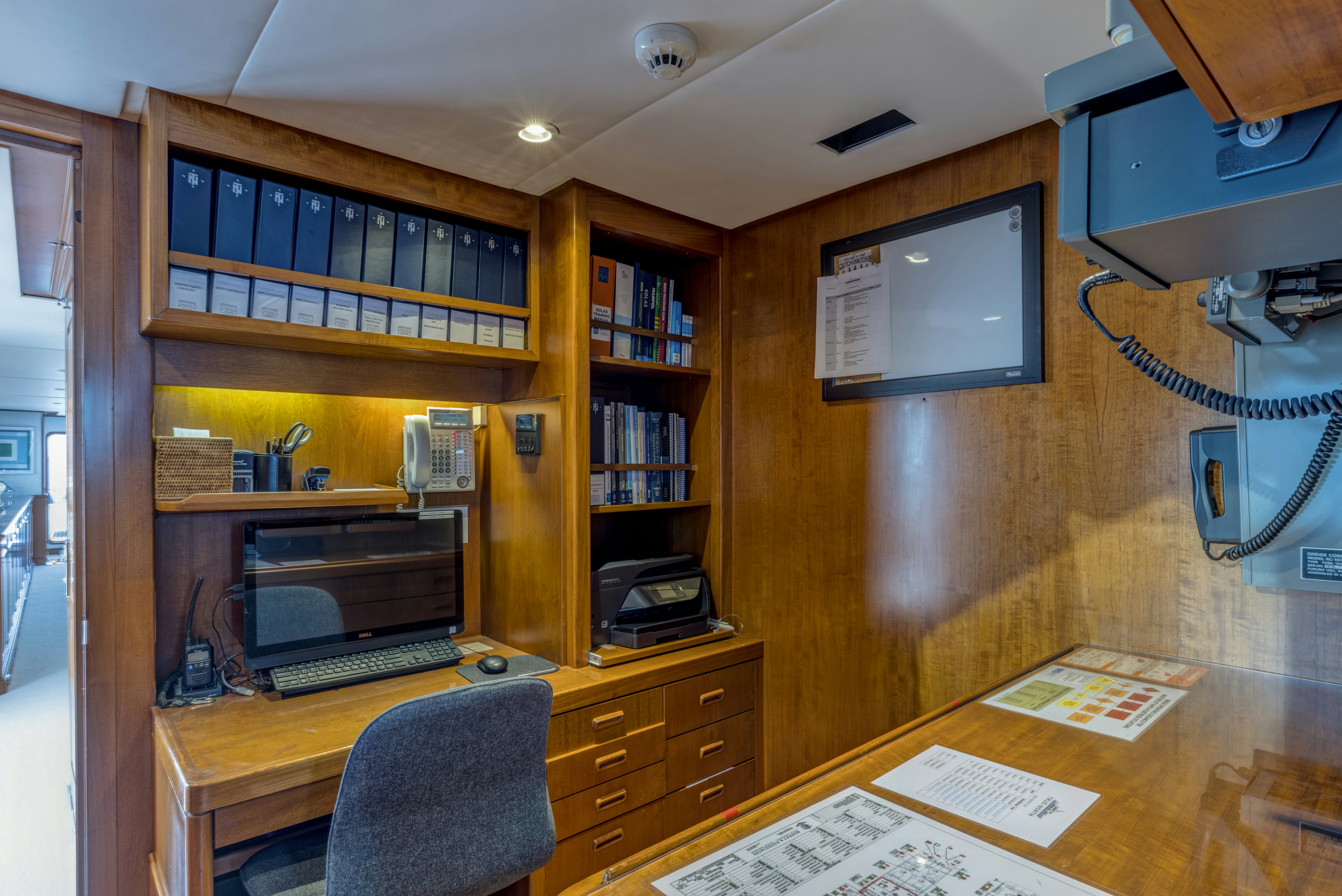 a room with a desk and computer aboard TRUE NORTH Yacht for Sale