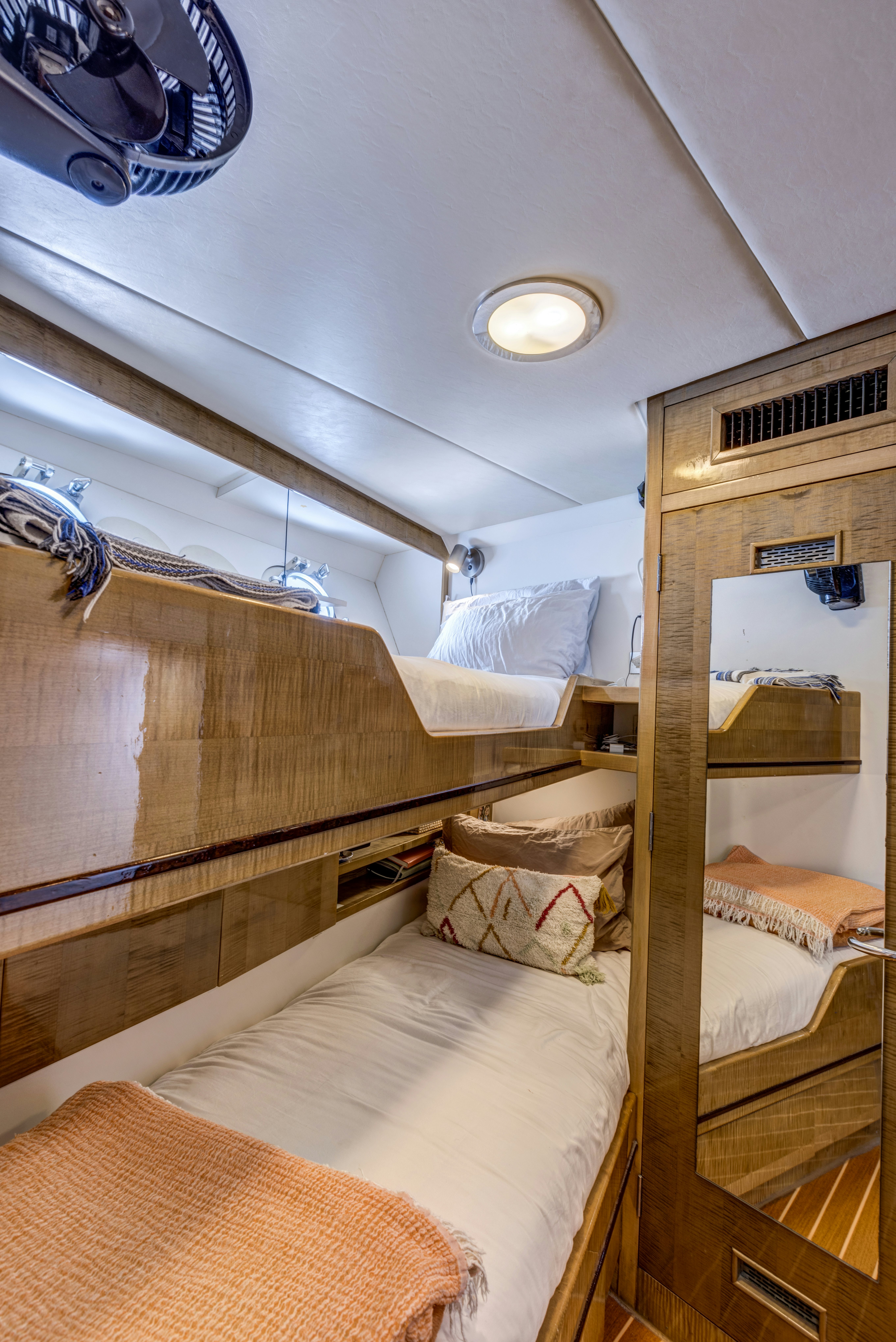 a bunk bed with a wood headboard aboard TRUE NORTH Yacht for Sale