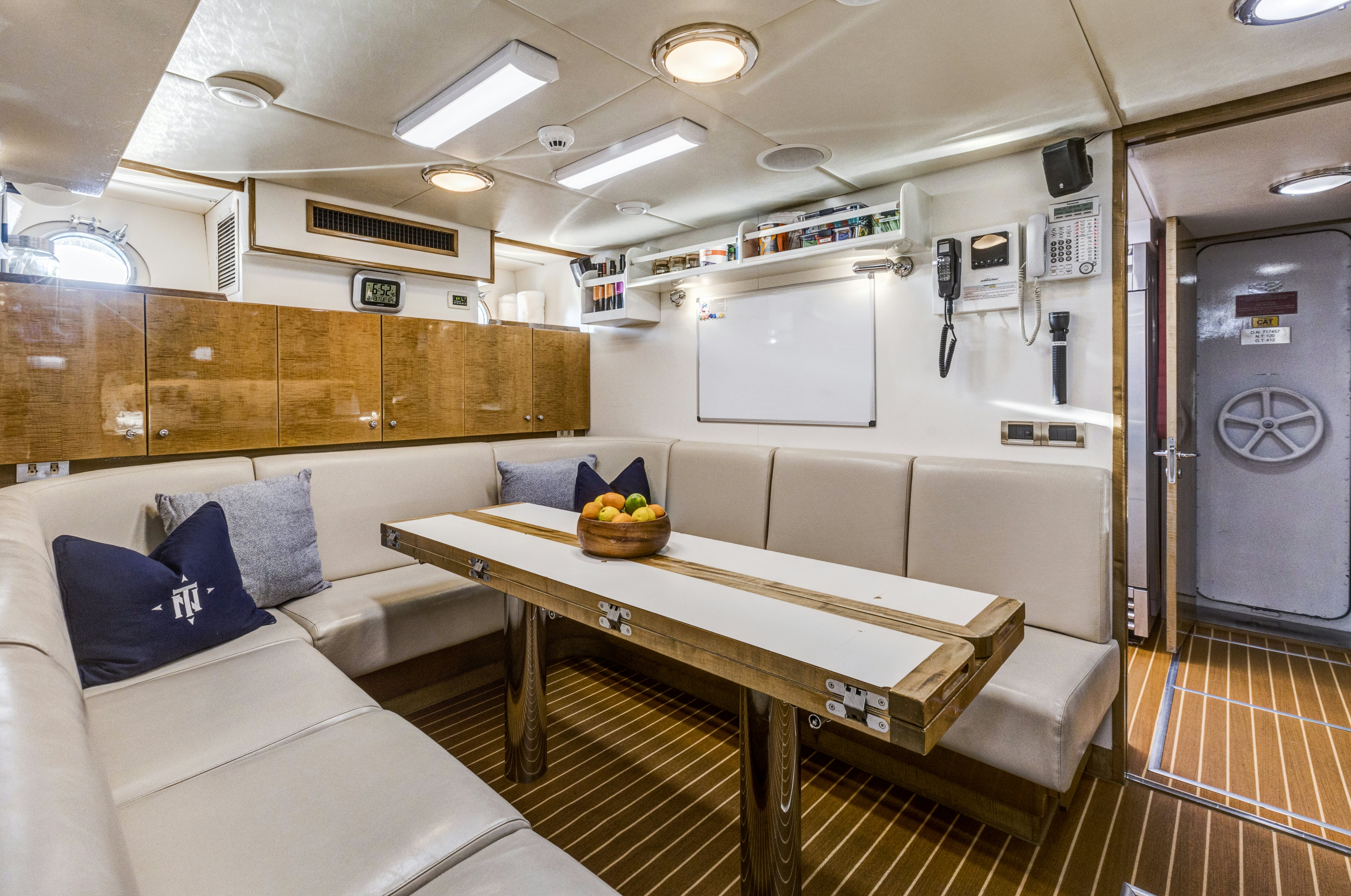 a room with a couch and a table aboard TRUE NORTH Yacht for Sale