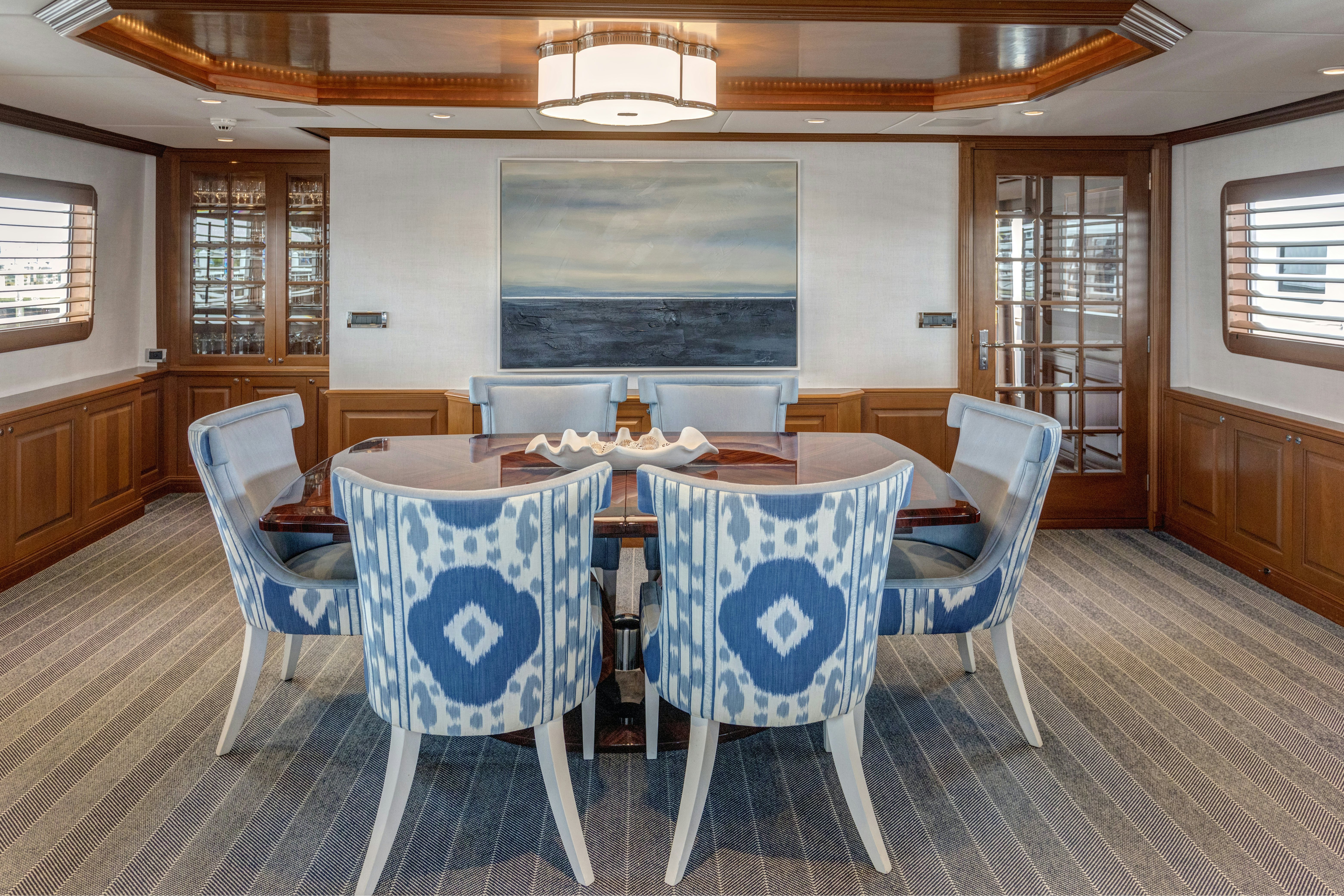 a room with chairs and a table aboard TRUE NORTH Yacht for Sale