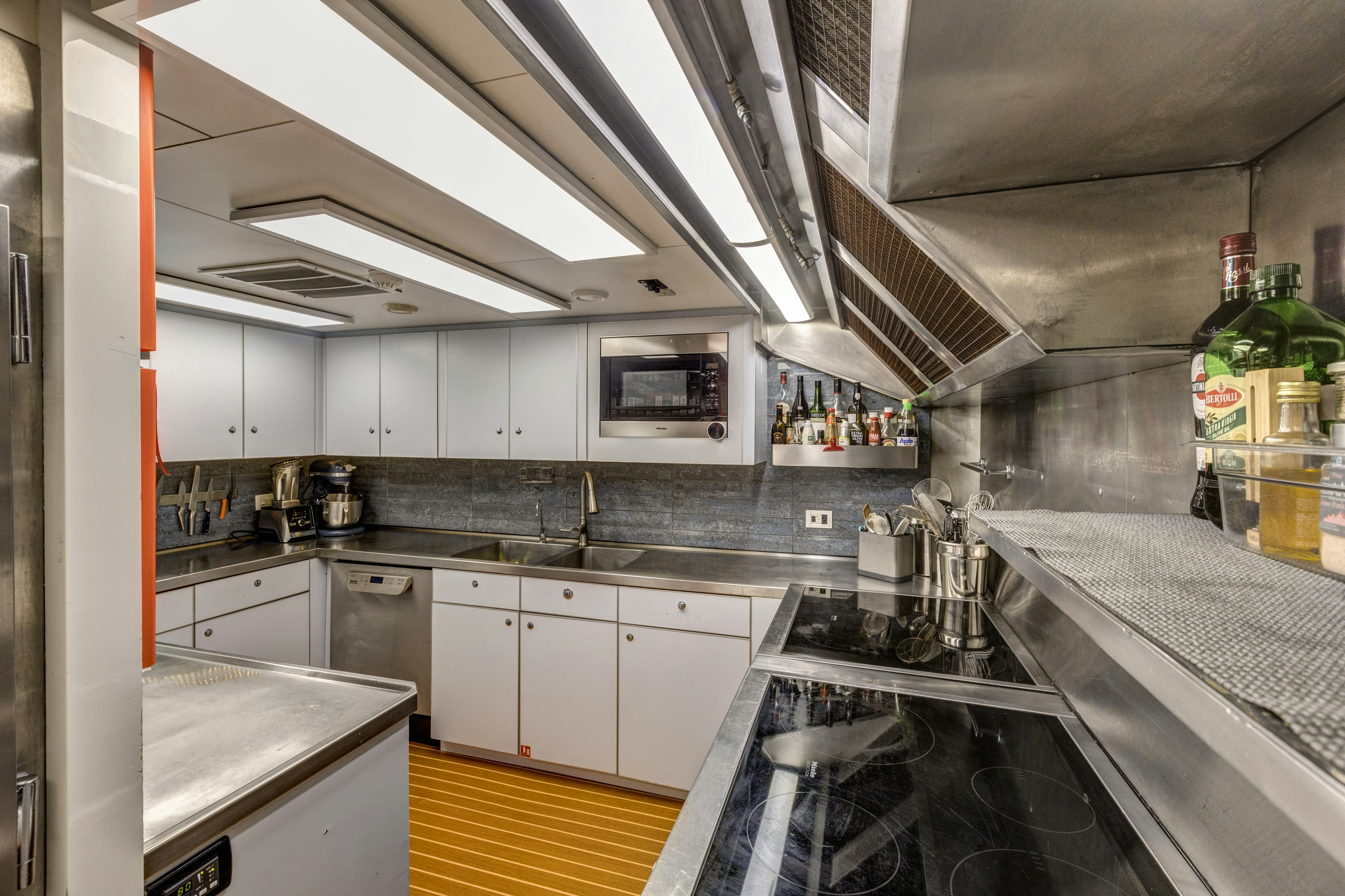 a kitchen with a large island aboard TRUE NORTH Yacht for Sale
