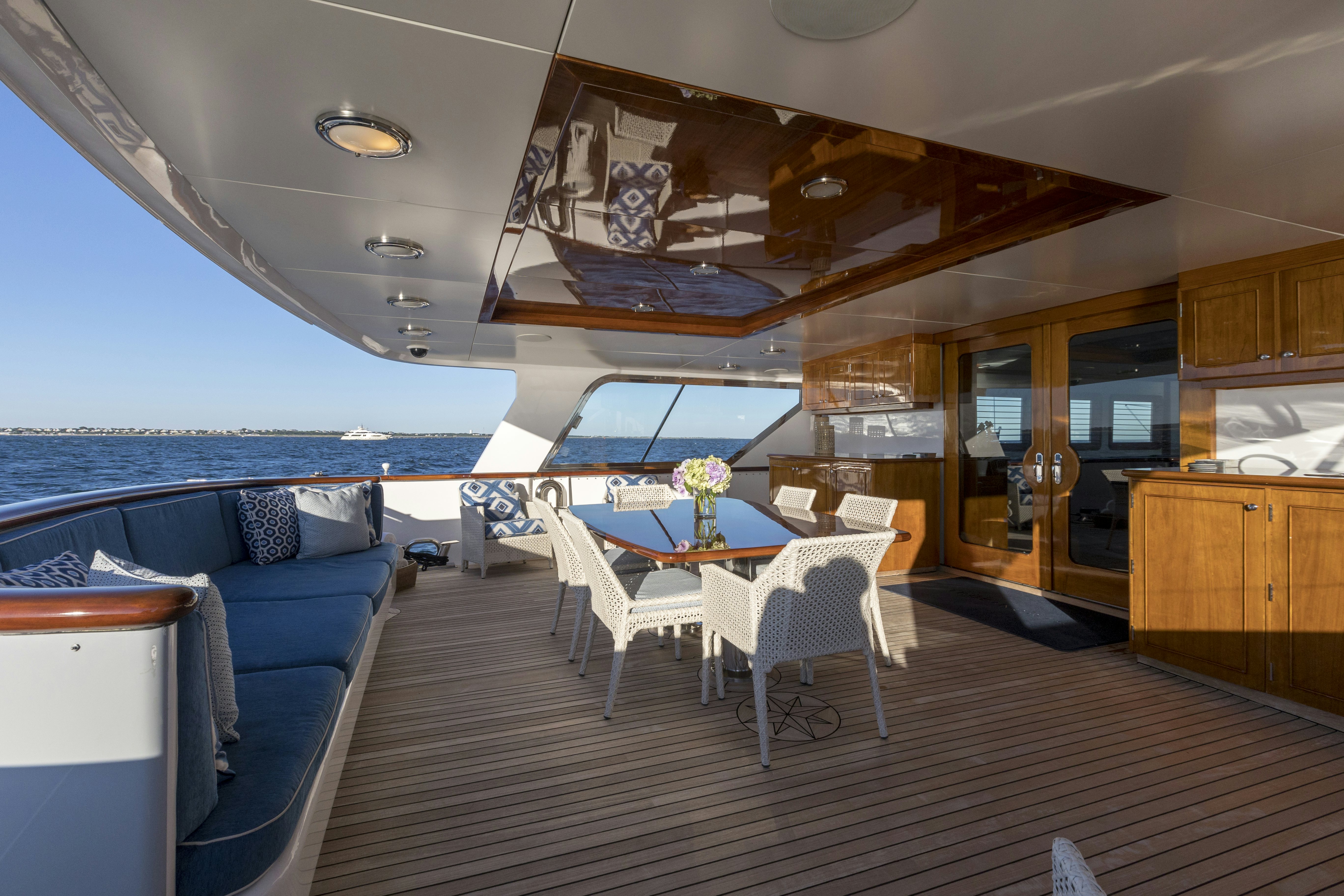 a room with a table and chairs aboard TRUE NORTH Yacht for Sale