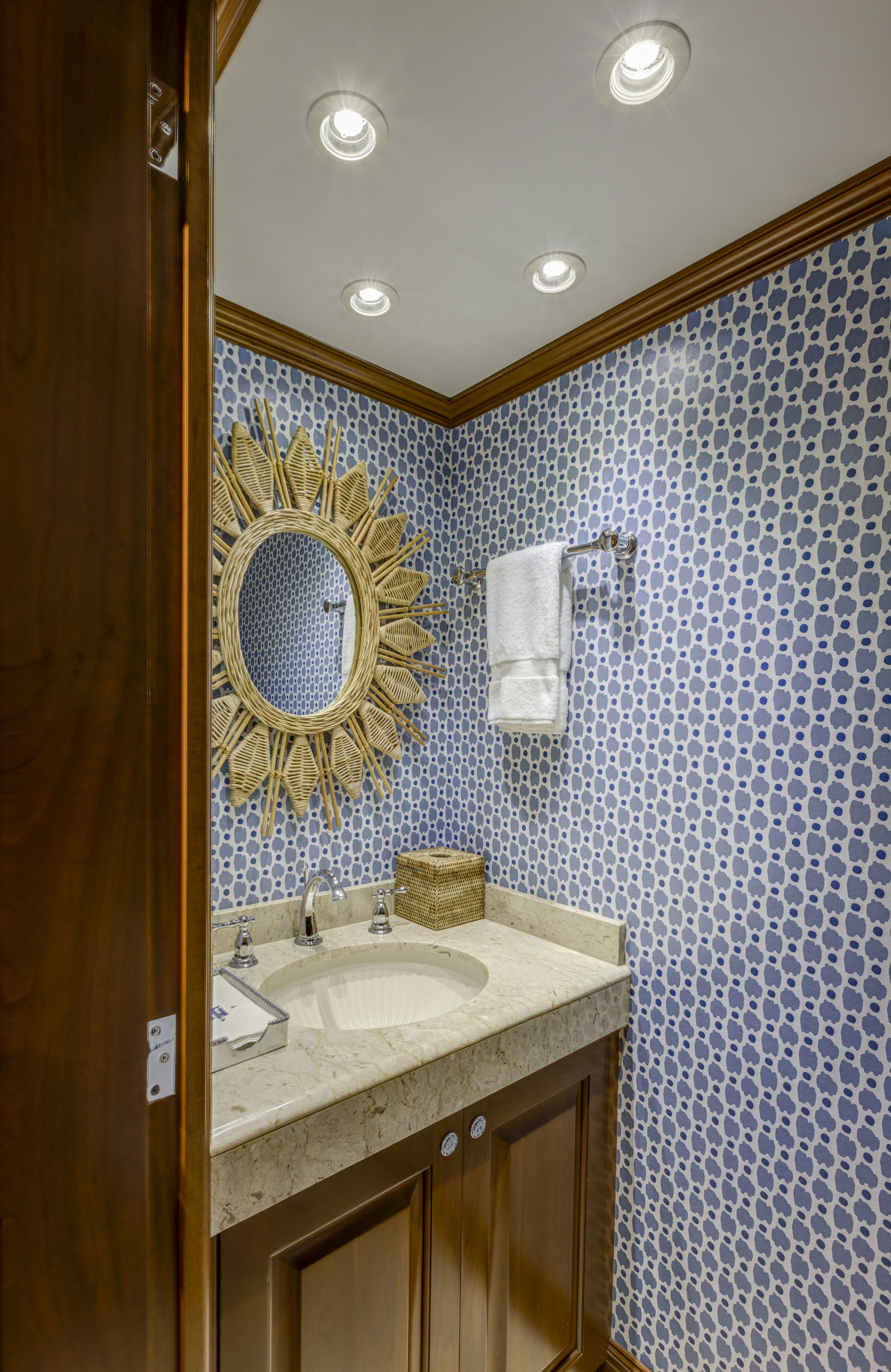 a bathroom with a sink and a mirror aboard TRUE NORTH Yacht for Sale