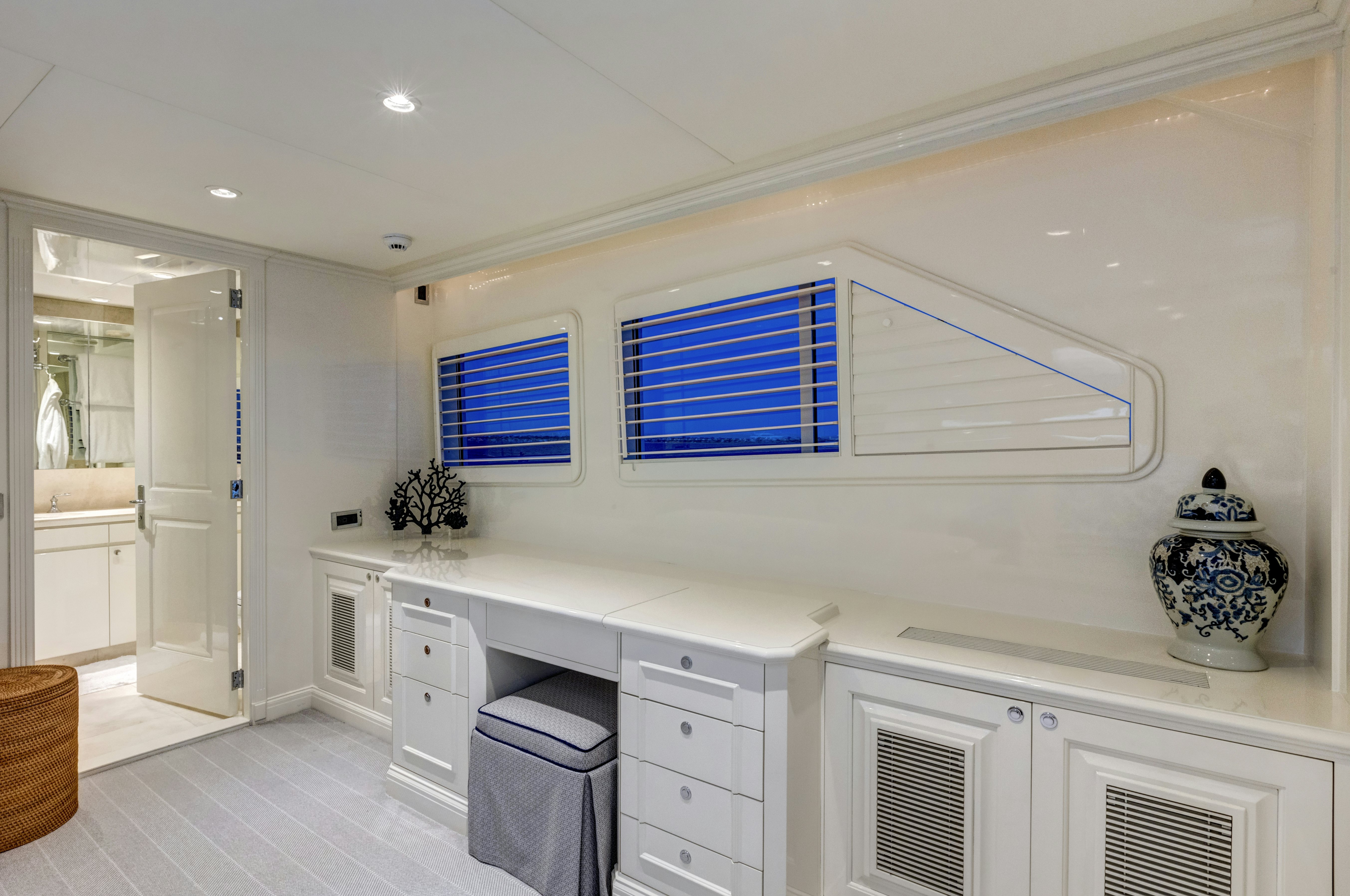 a kitchen with white cabinets aboard TRUE NORTH Yacht for Sale