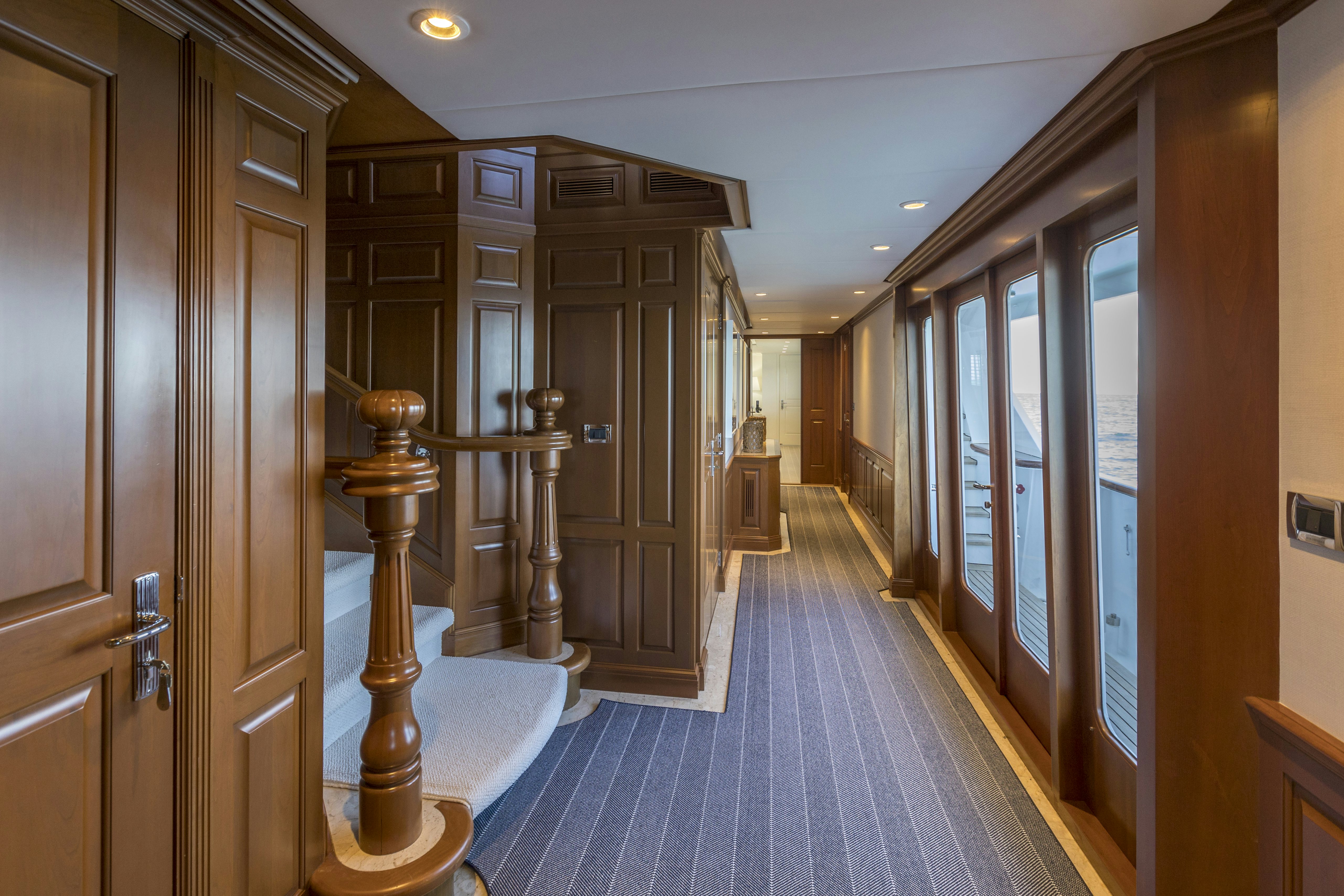 a hallway with doors and windows aboard TRUE NORTH Yacht for Sale