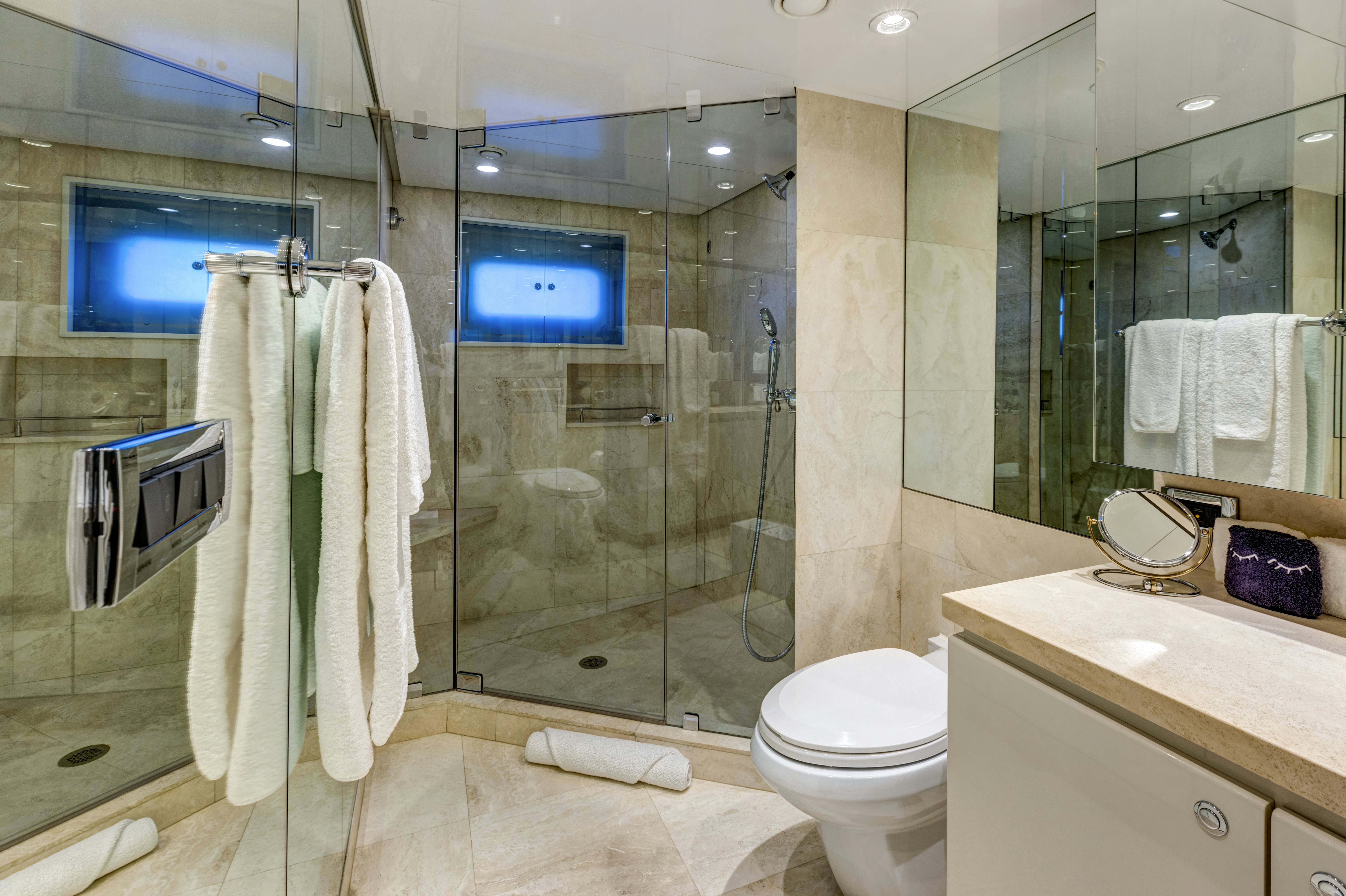 a bathroom with a glass shower aboard TRUE NORTH Yacht for Sale