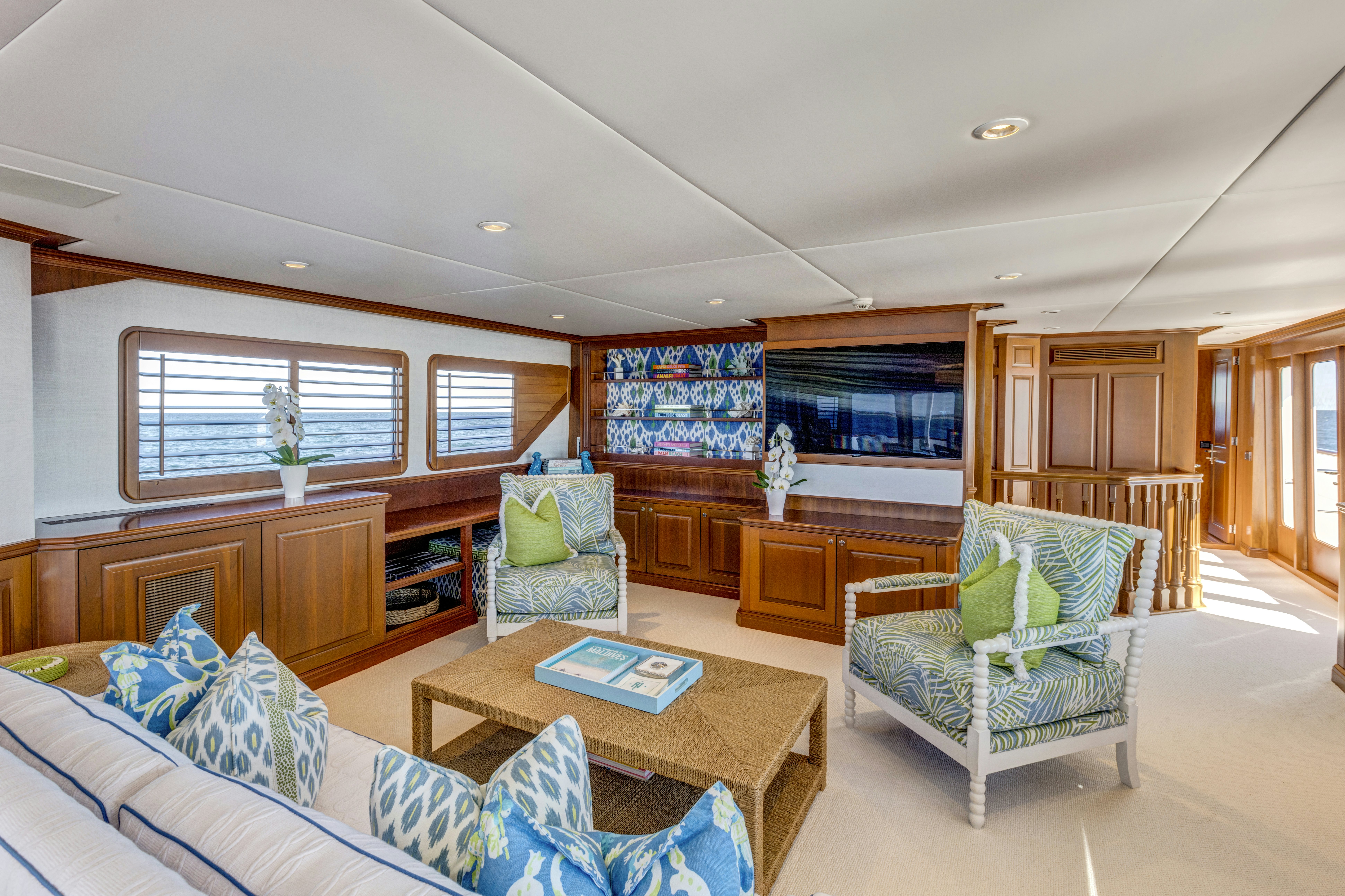 a living room with a couch and a coffee table aboard TRUE NORTH Yacht for Sale