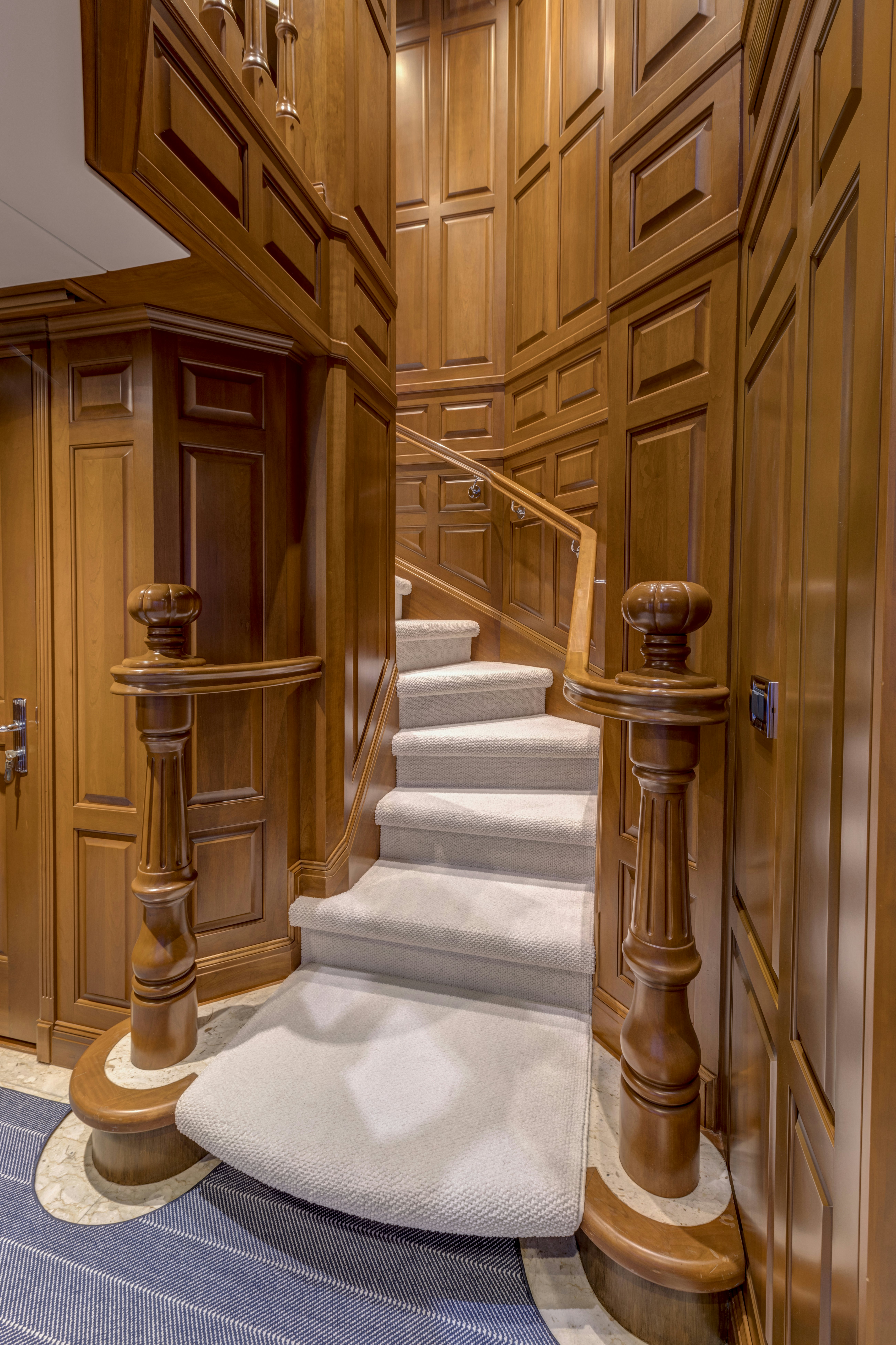 a staircase in a building aboard TRUE NORTH Yacht for Sale