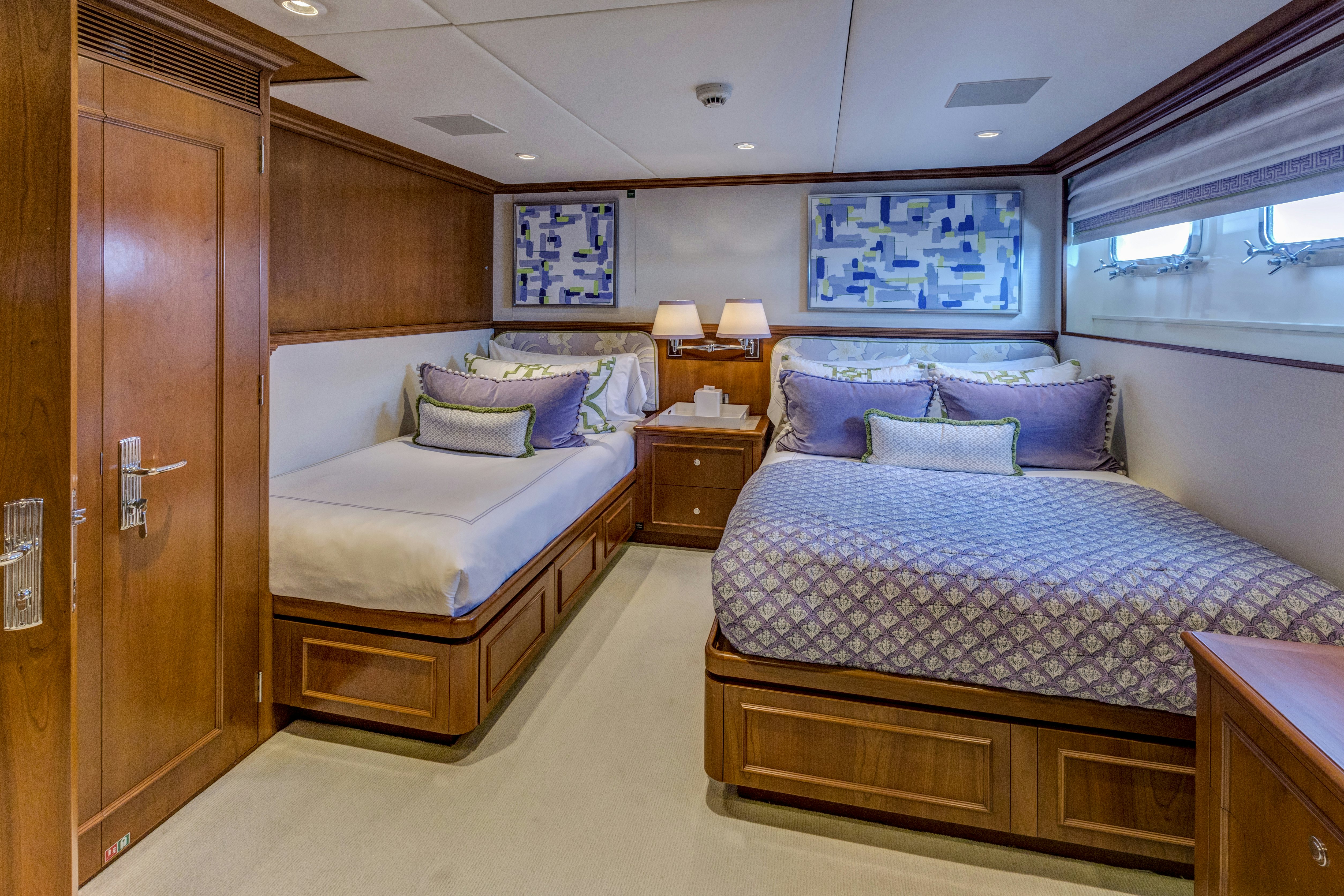 a couple of beds in a hotel room aboard TRUE NORTH Yacht for Sale