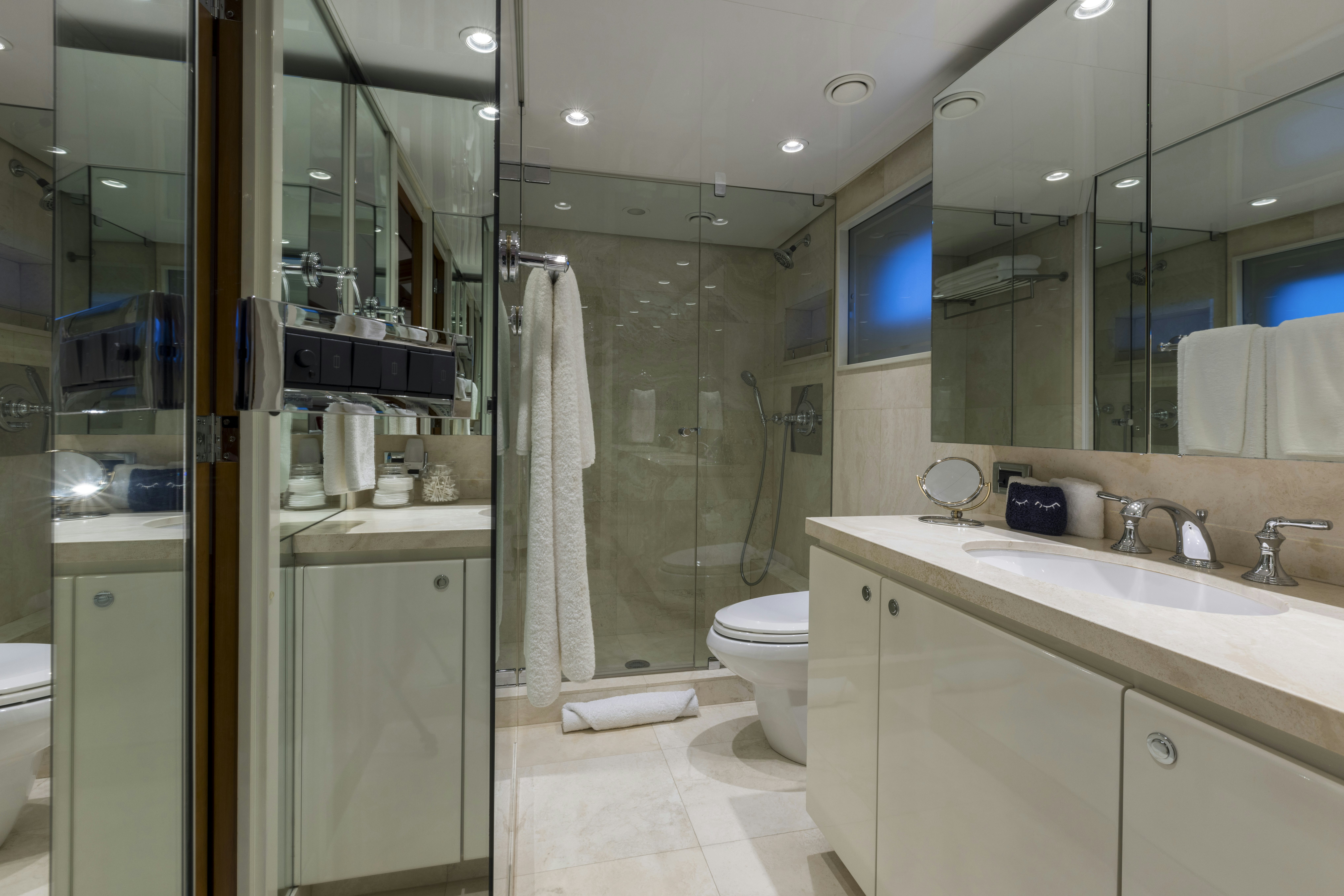 a bathroom with a glass shower aboard TRUE NORTH Yacht for Sale