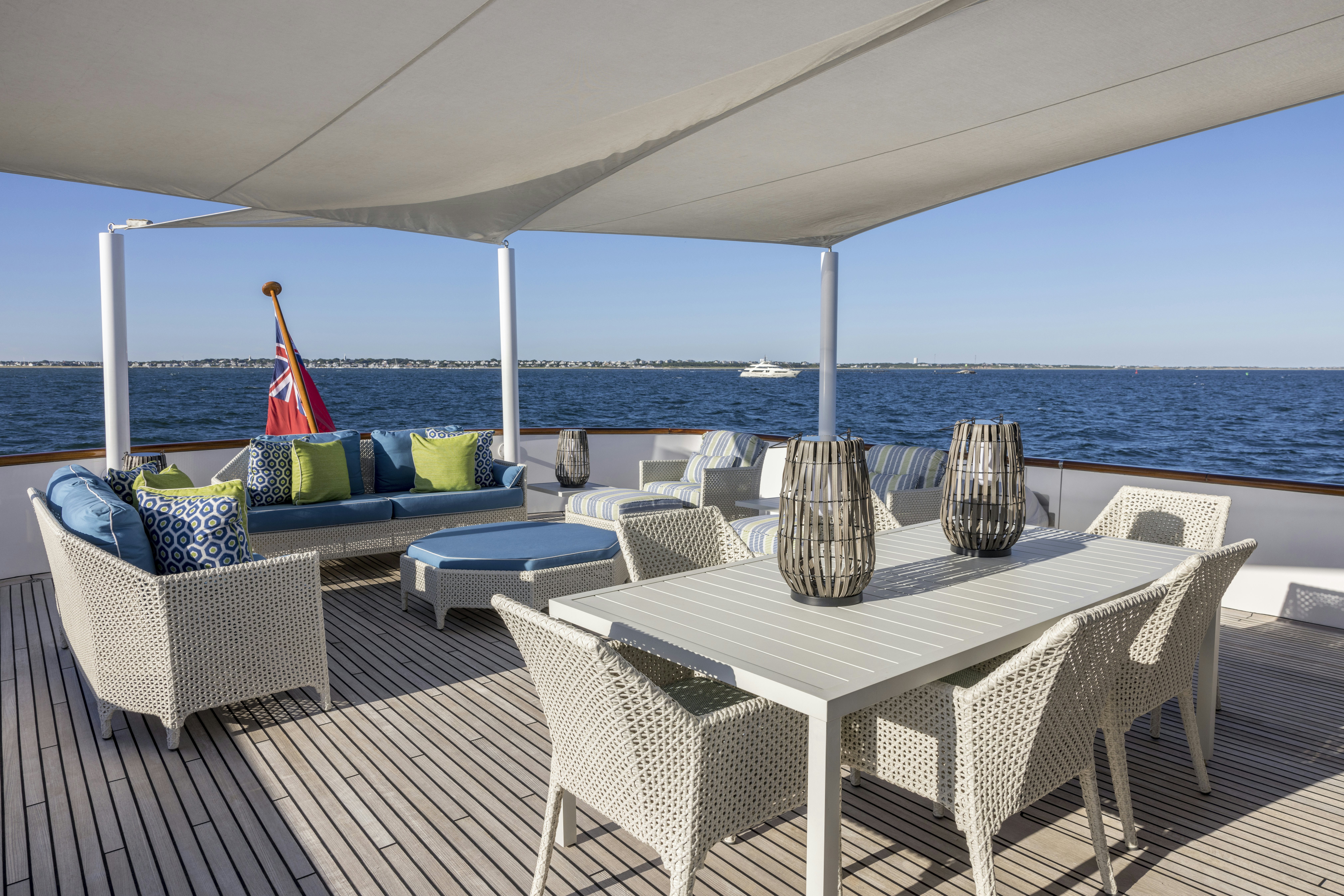 a table and chairs on a deck aboard TRUE NORTH Yacht for Sale