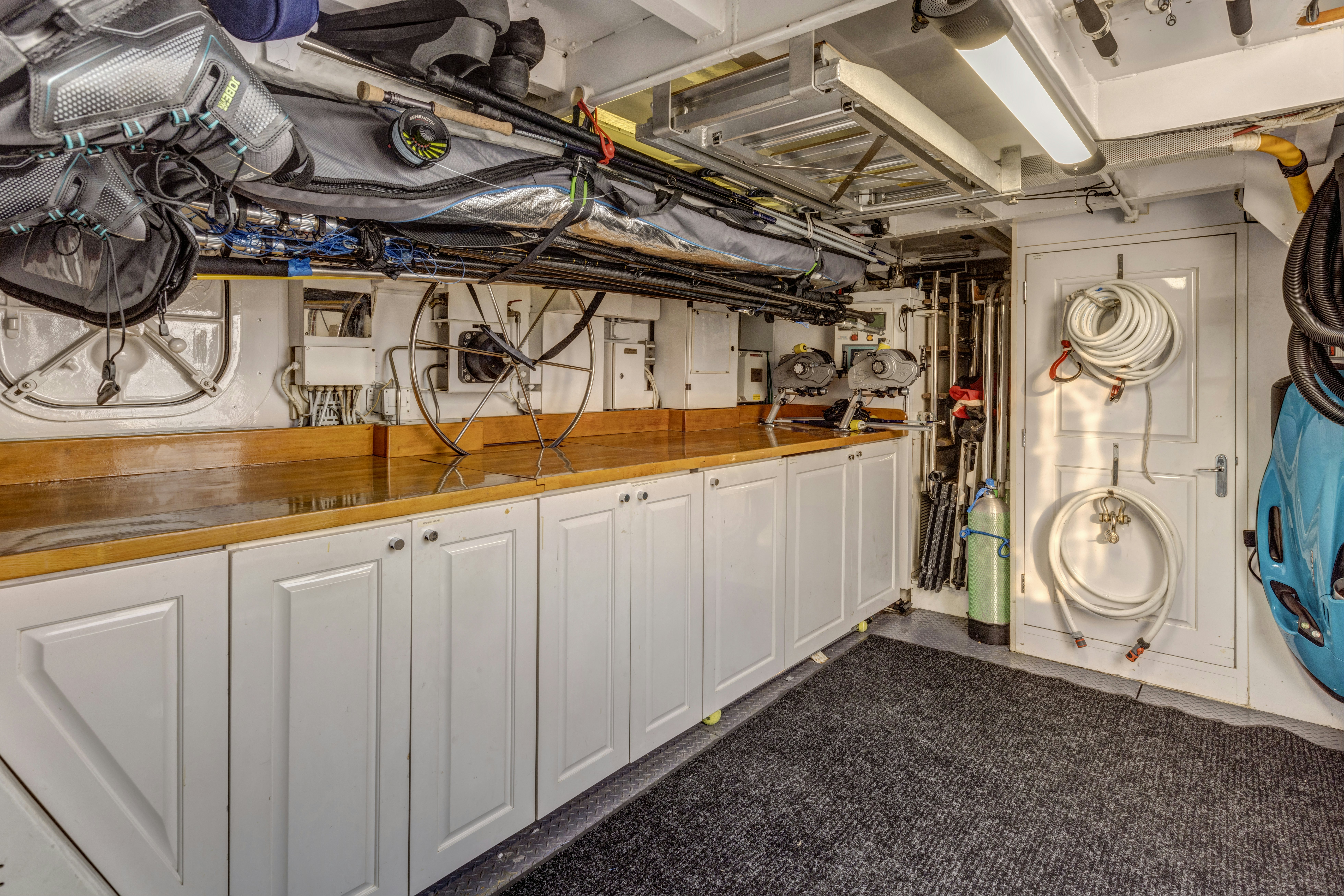 a room with white cabinets and white cabinets aboard TRUE NORTH Yacht for Sale