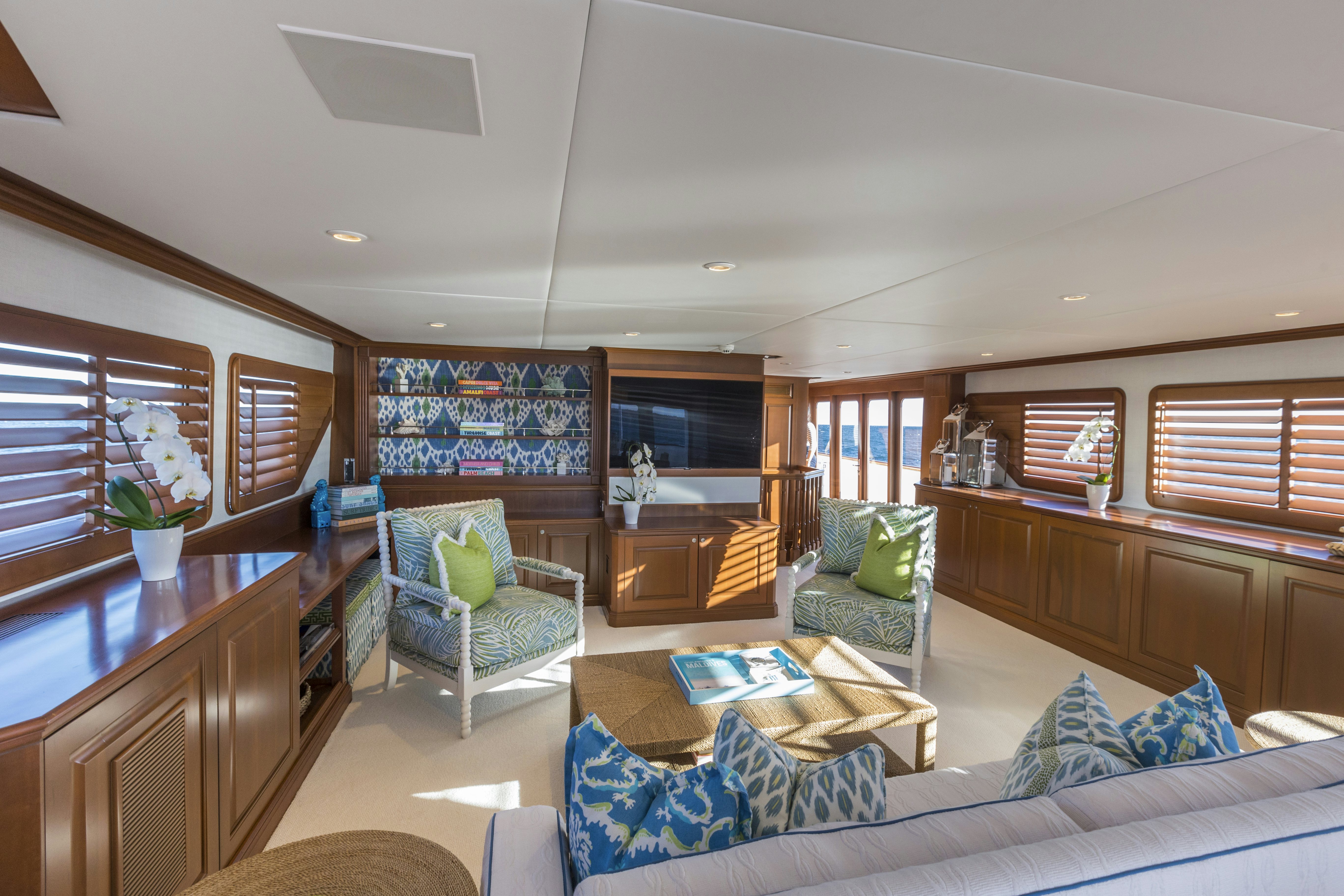 a living room with a couch and a coffee table aboard TRUE NORTH Yacht for Sale