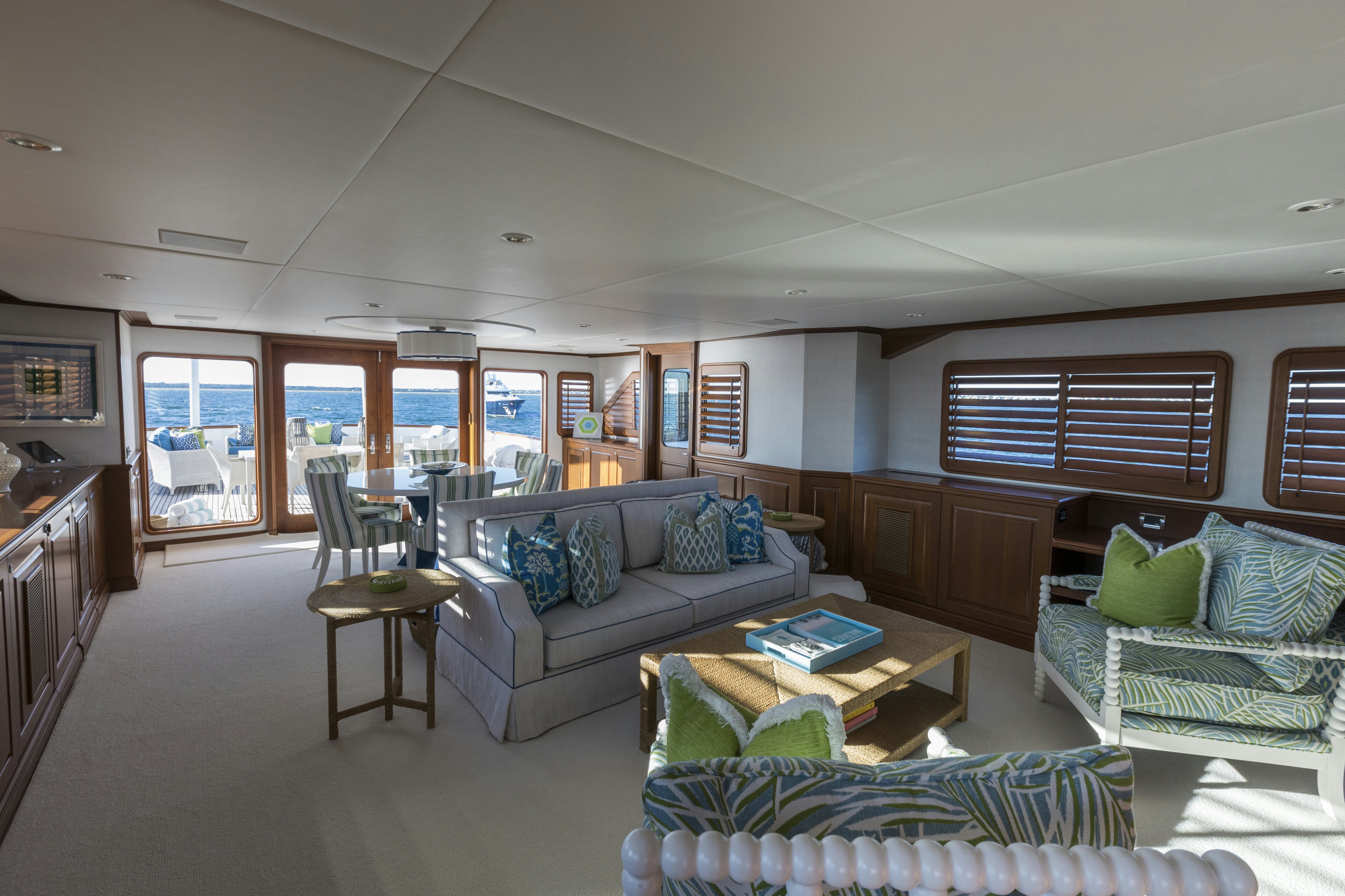 a living room with a couch and a coffee table aboard TRUE NORTH Yacht for Sale