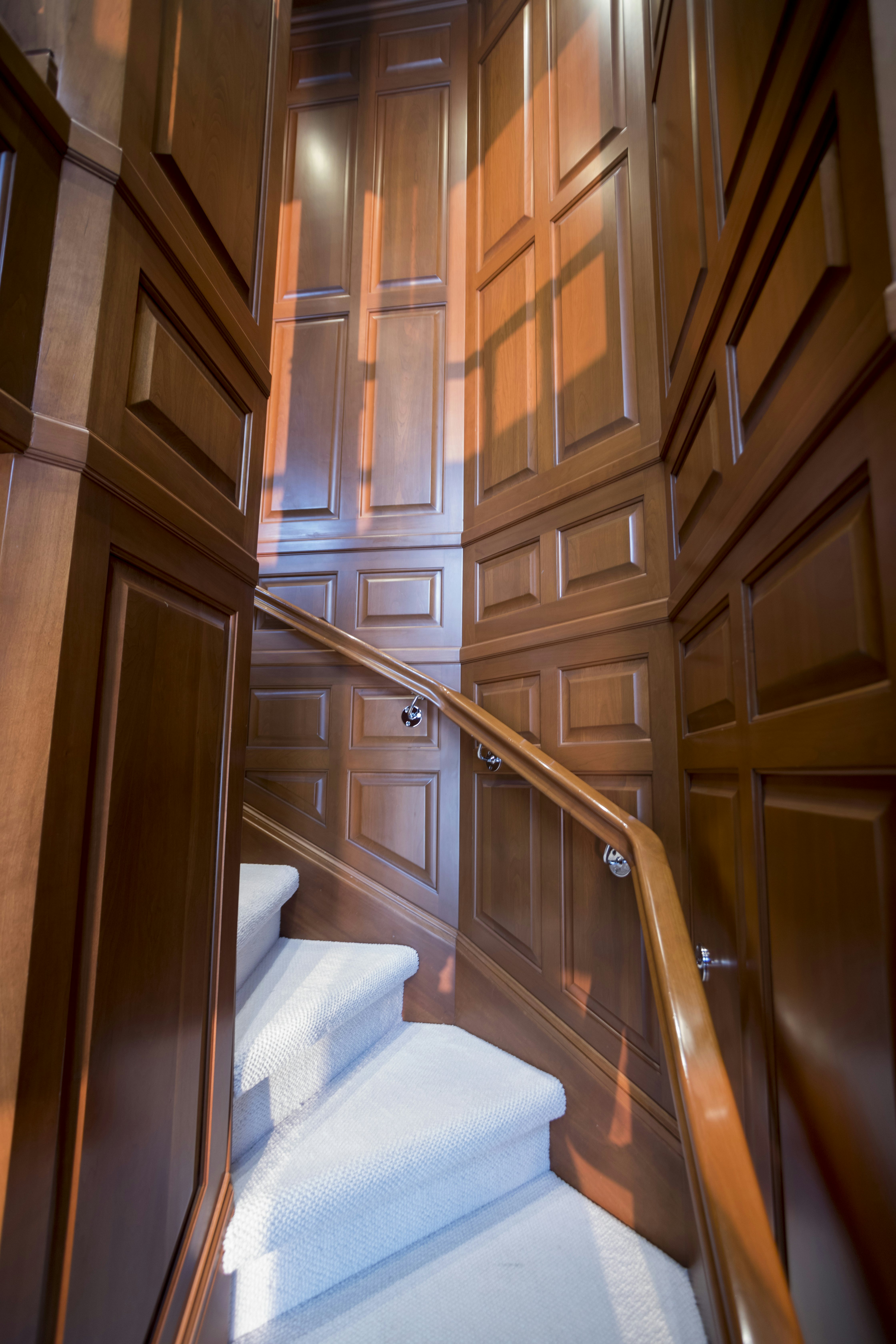 a room with wooden cabinets aboard TRUE NORTH Yacht for Sale