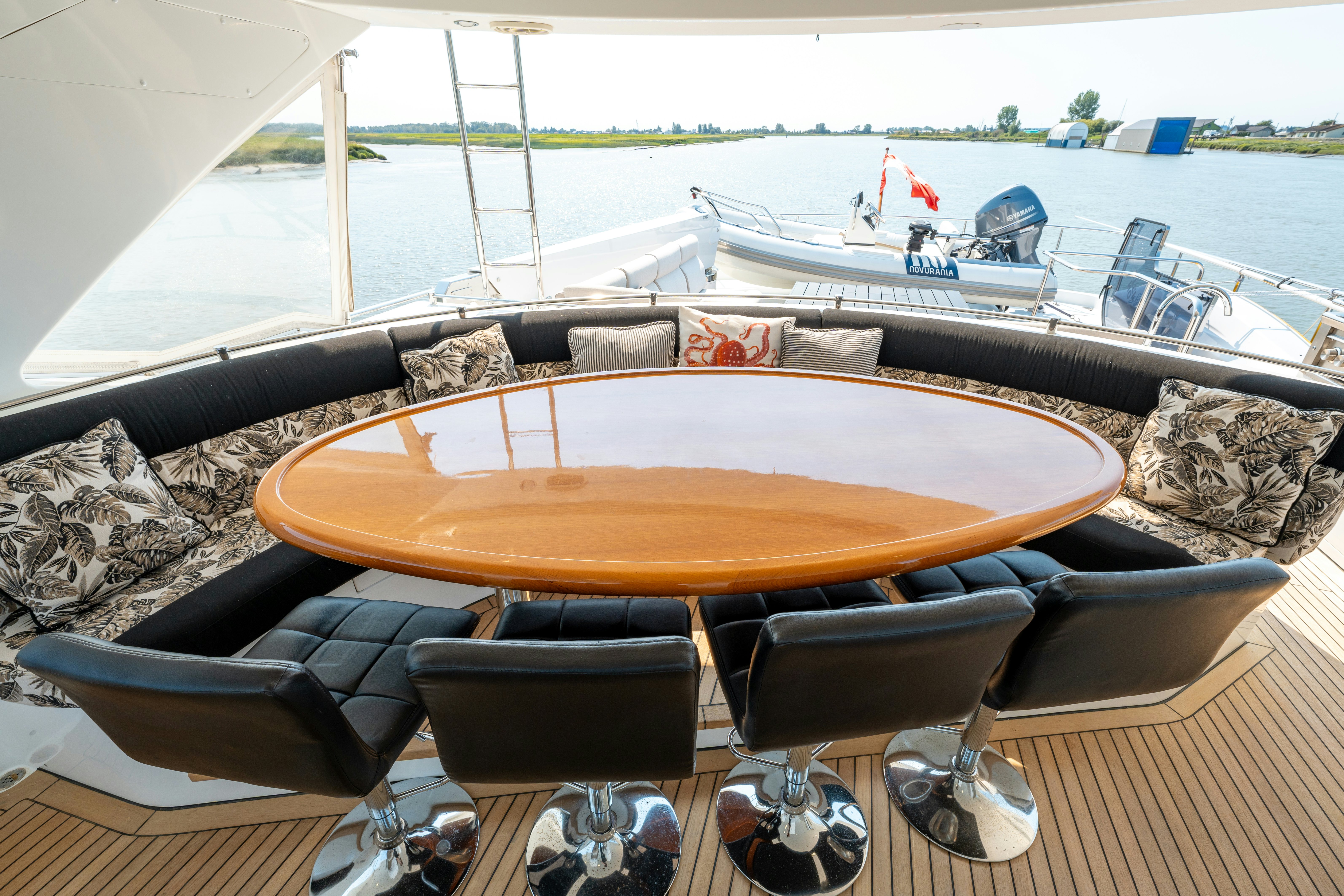 a table and chairs on a deck aboard MEMORY BANK Yacht for Sale